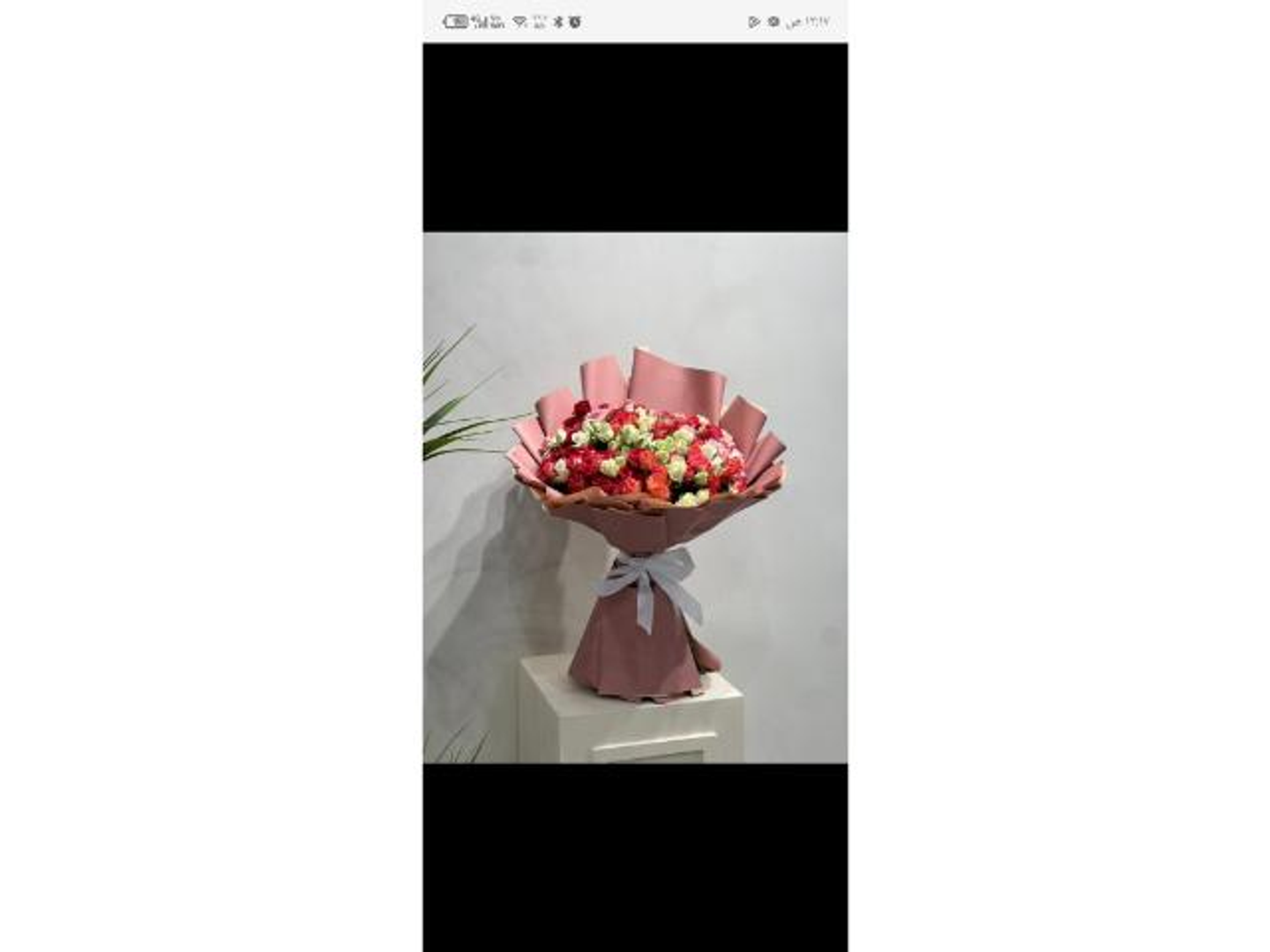 Colored Rose Bouquet In Pink Wrapping