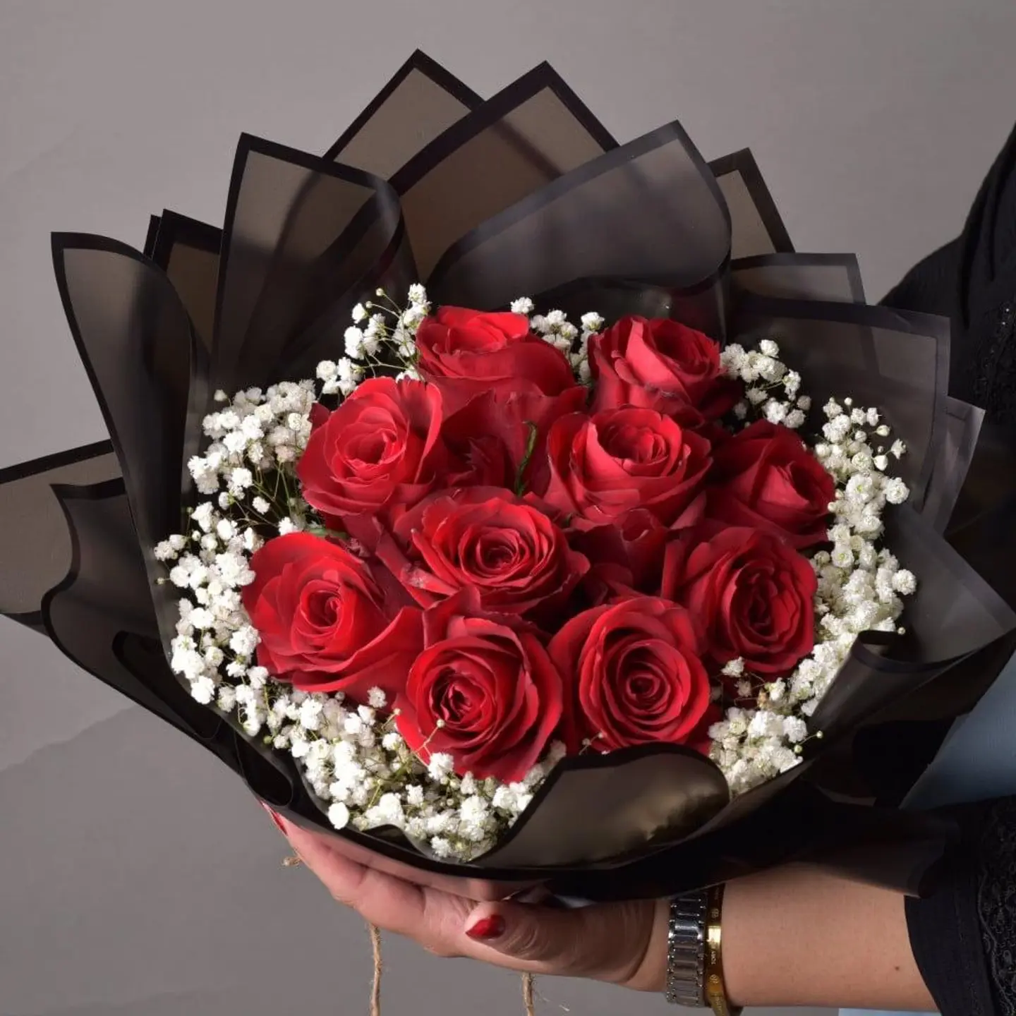 A Bouquet Of Red Roses With Gypsum