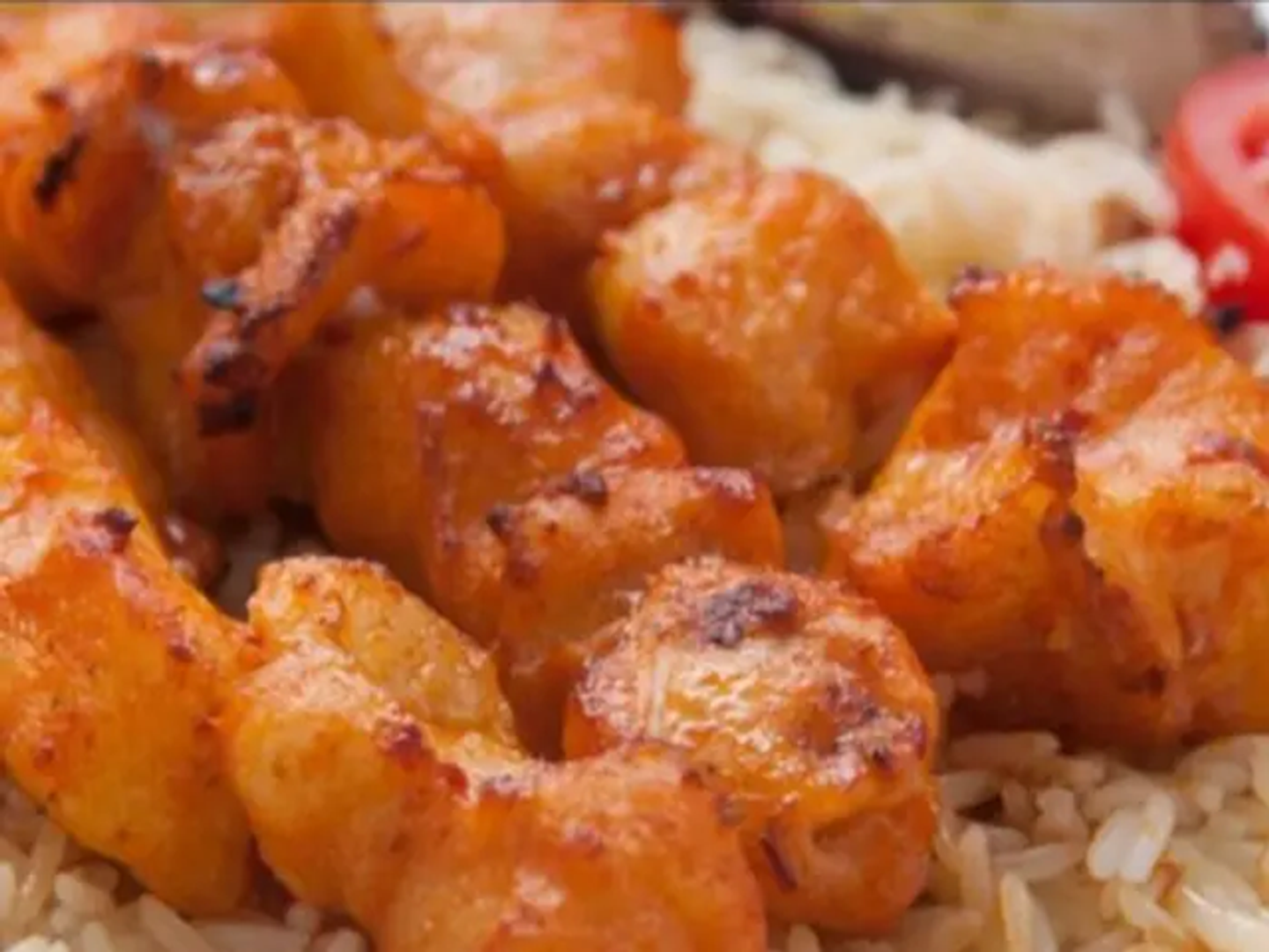 Two Fish Fillet Skewers With Bechamel Rice And Hot Tahini And Daqoos Sauce