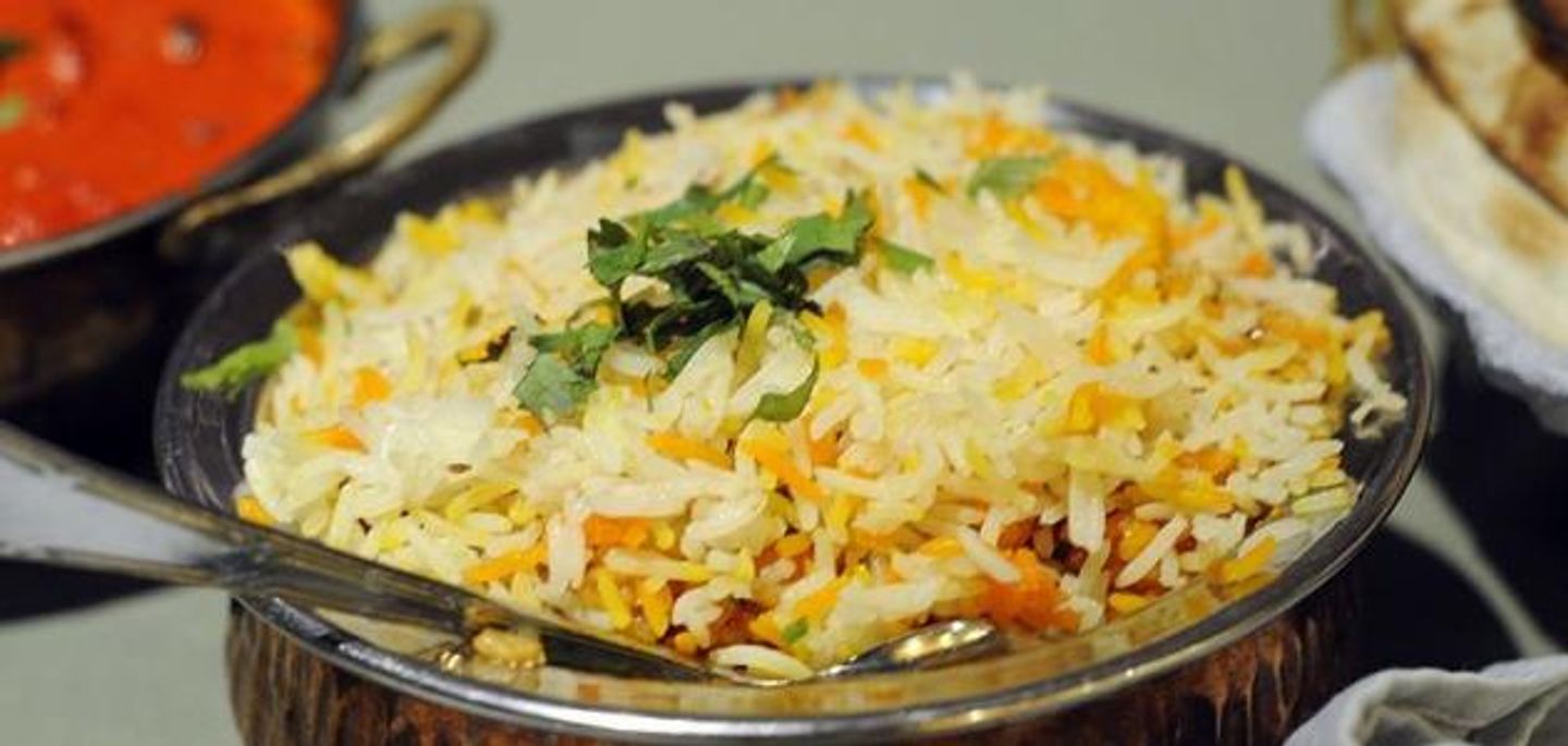 Person White Rice Biryani