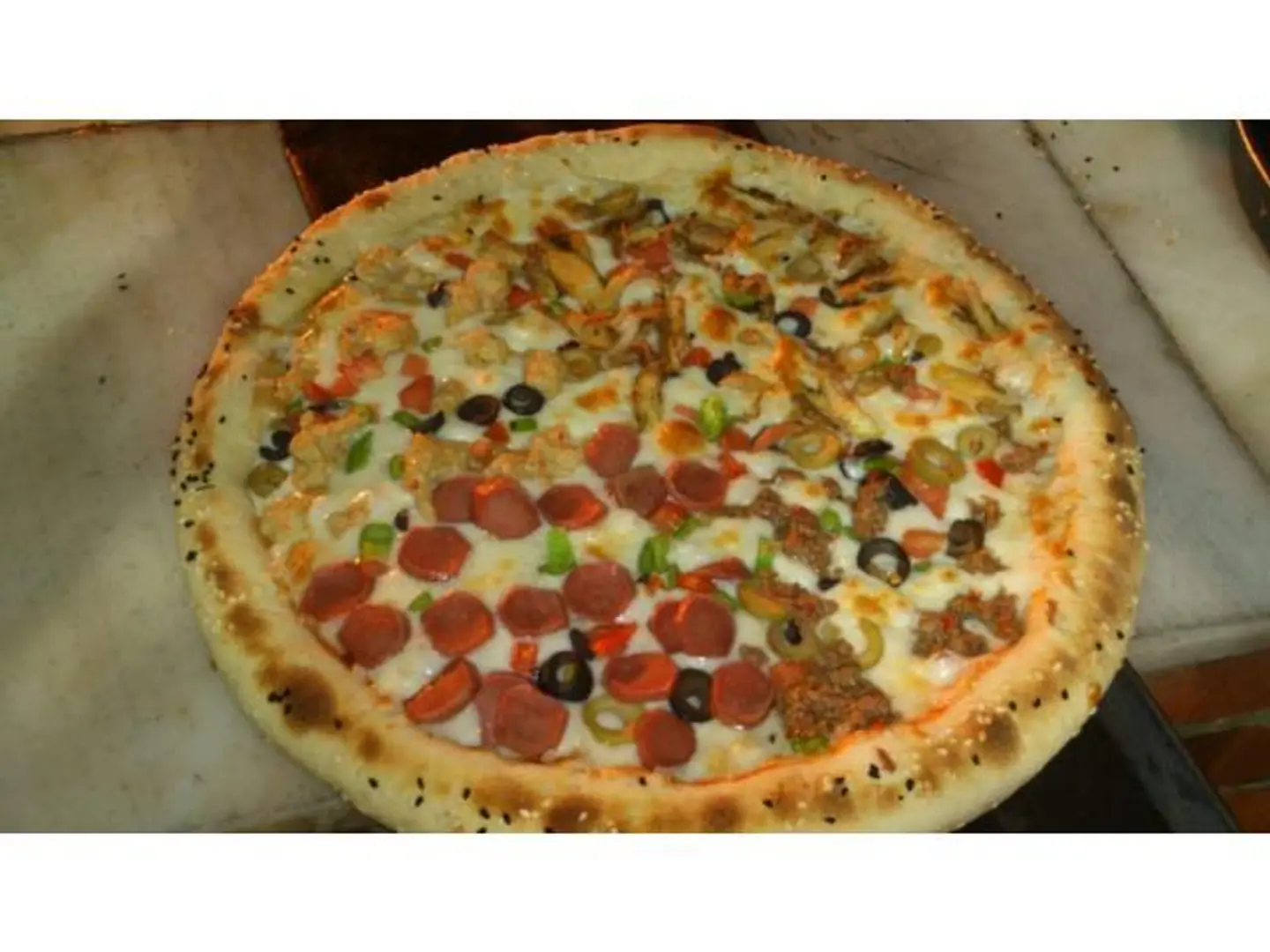 بيتزا الفصول الأربعة