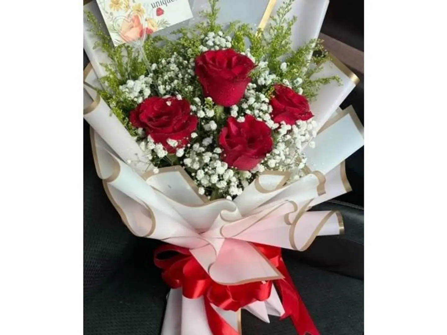 Four Red Roses With White Wrapping
