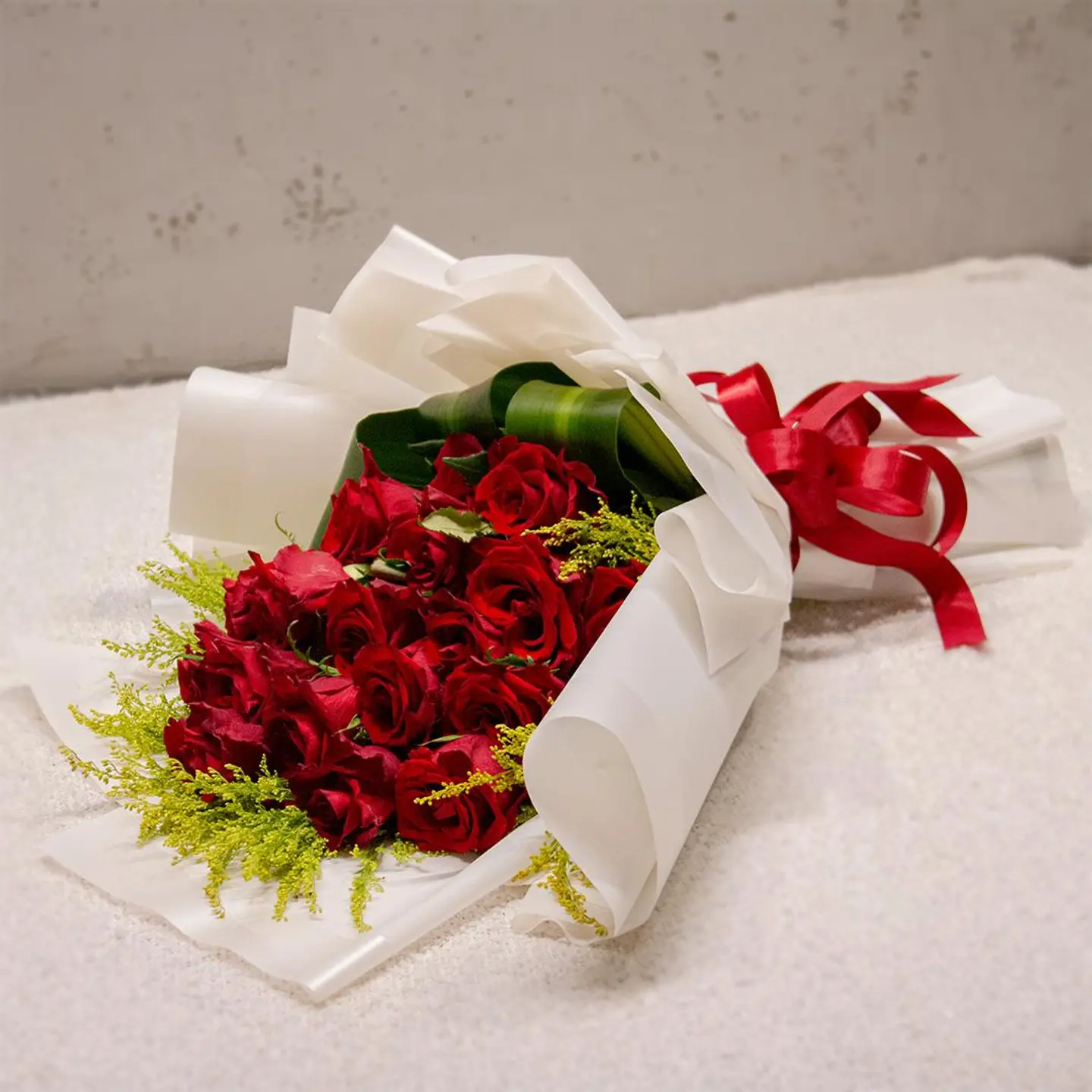 Red Flowers Buoquet And White Wrapping