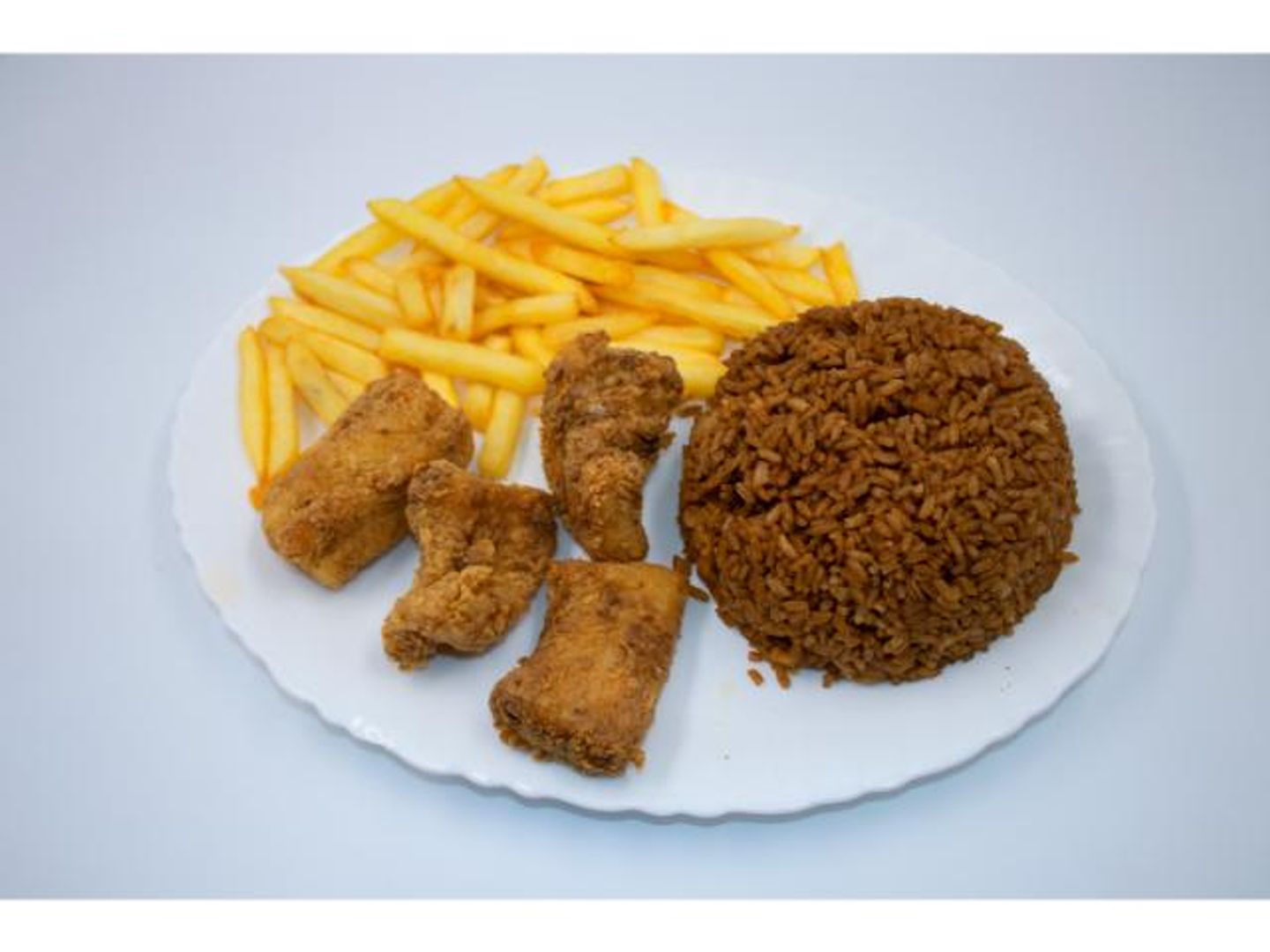Fried Fish Filliet And Rice With Fries Meal