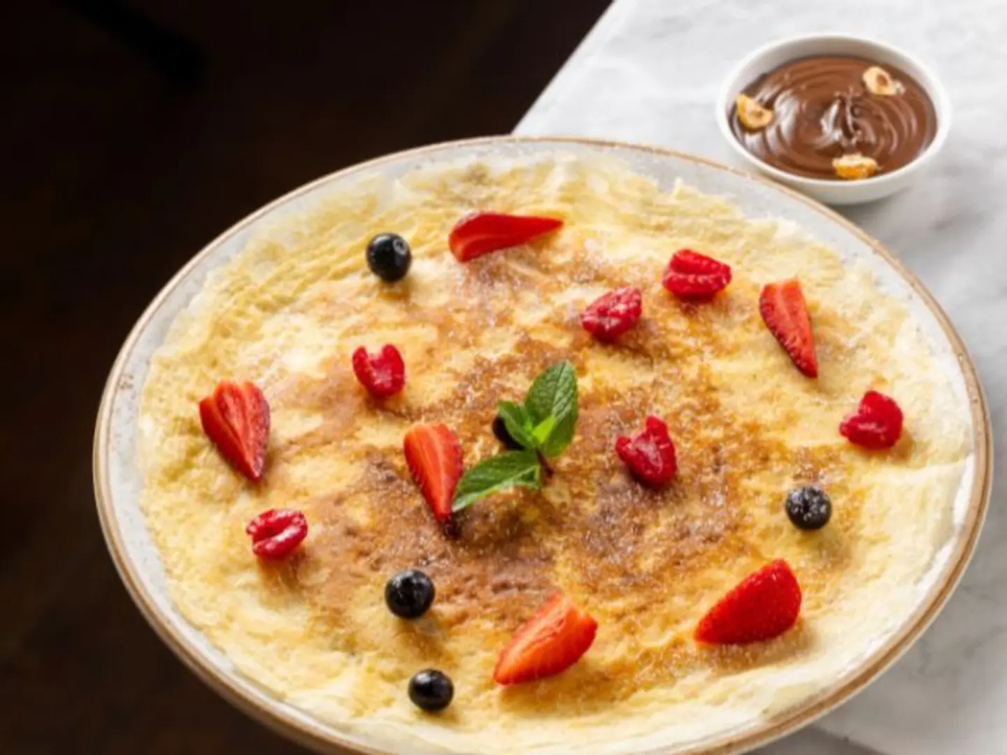 House Made Crepe With Berries & Nutella