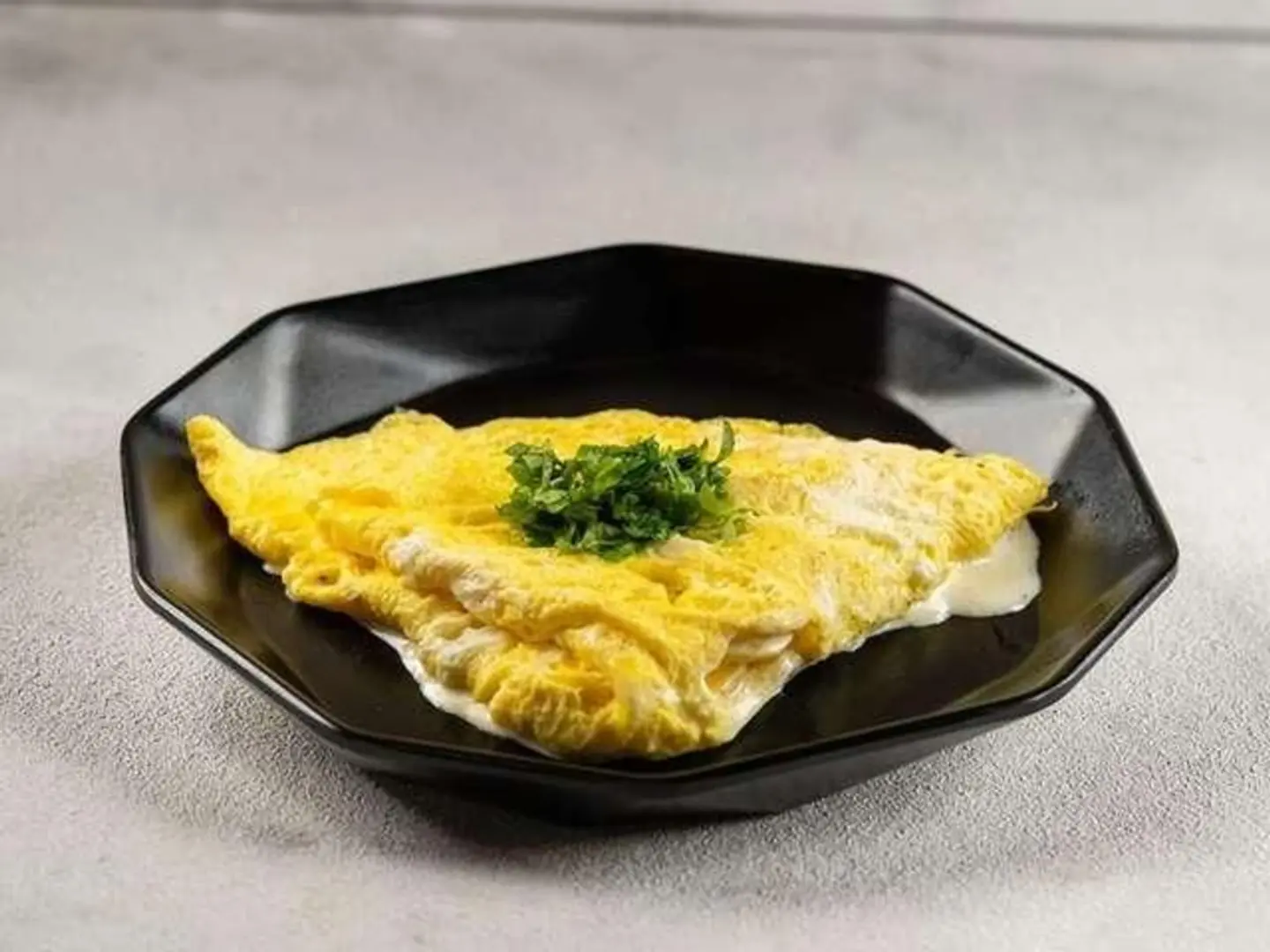 Fried Or Scrambled Eggs Mixed With Melted Cheese.