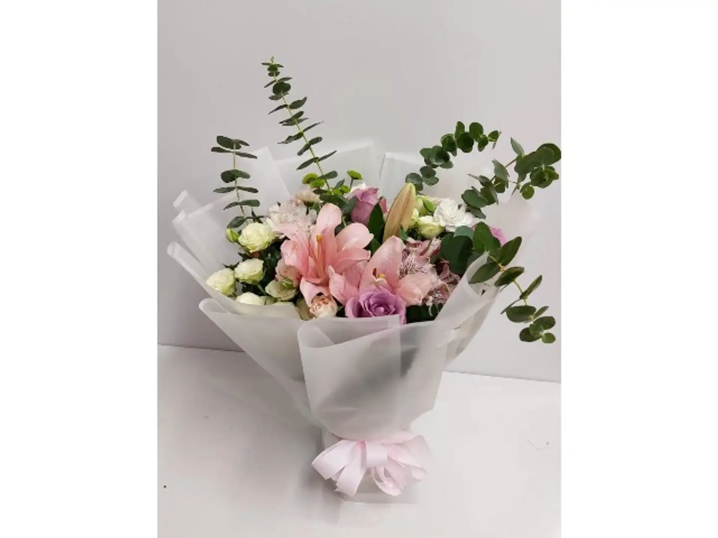 1026 Base Bouquet Of 2 Pink Limunium,3 Roses,3 White Baby Roses, 2 Pink Astramaria,1 White Chrianthemum With Eeucalyptus