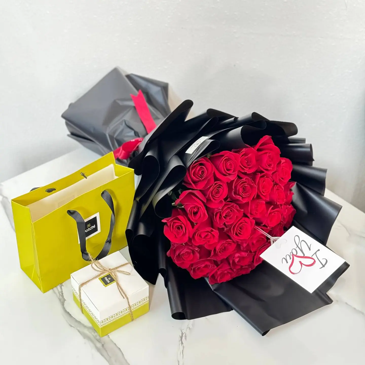 A Bouquet Of Roses With Patchi