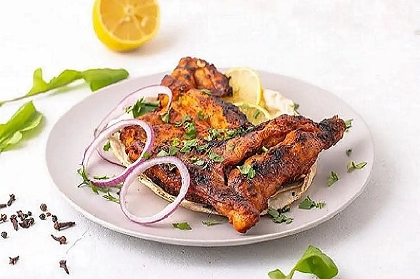 Half A Piece Of Chicken Grilled On Charcoal Without Rice