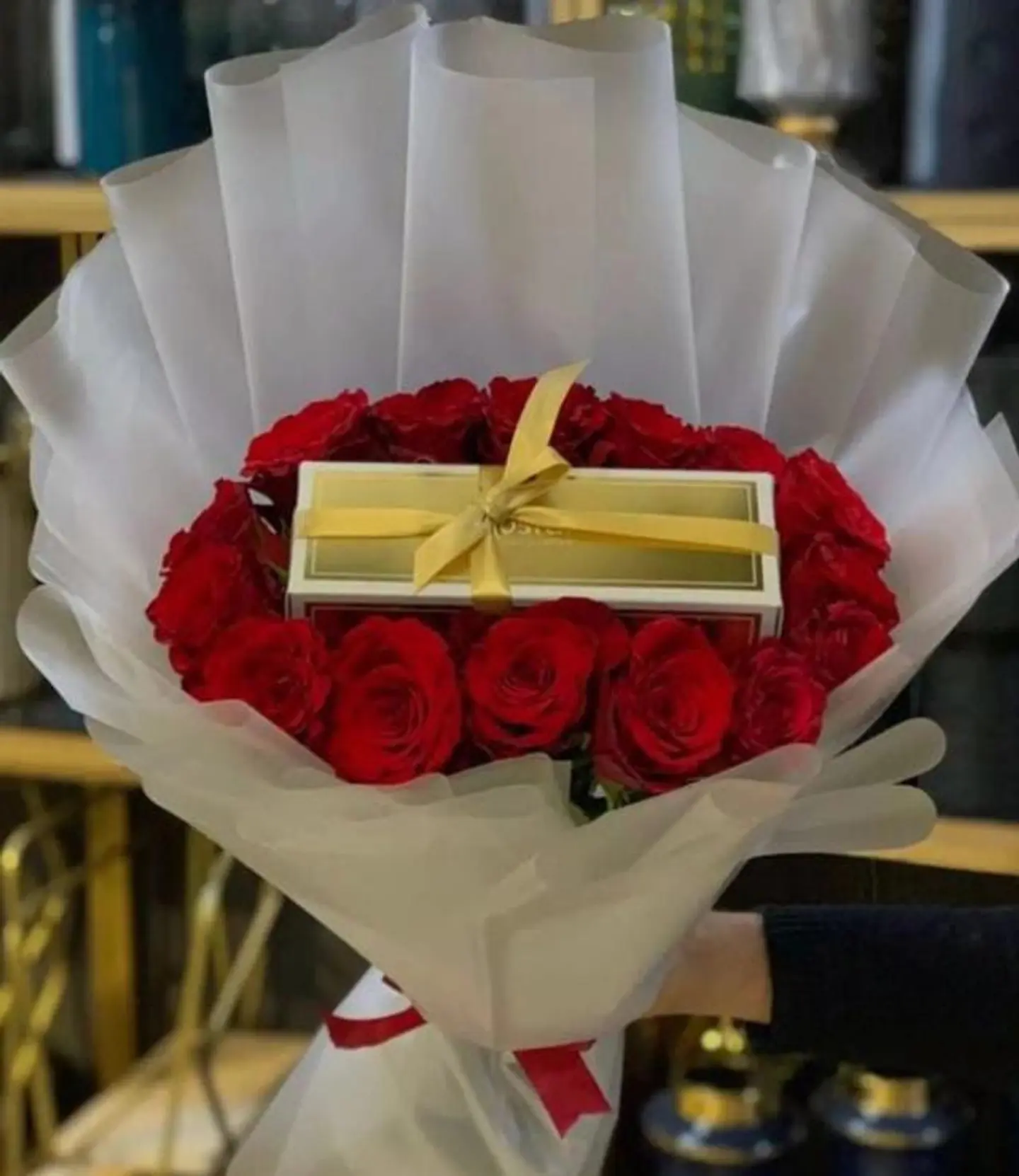 A Bouquet Of Red Roses With A Quarter Gardener