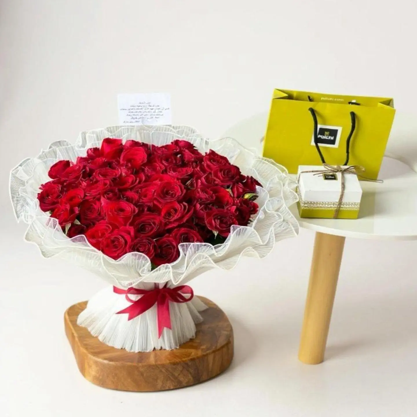A Bouquet Of Fresh Roses And Patachis Chocolates