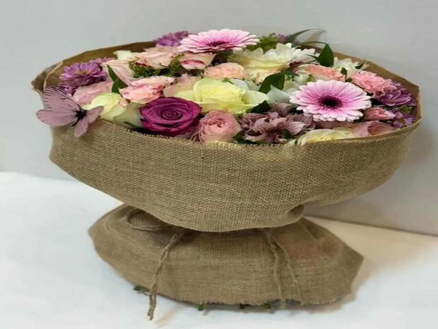 Bouquet Of Roses Wrapped In Burlap