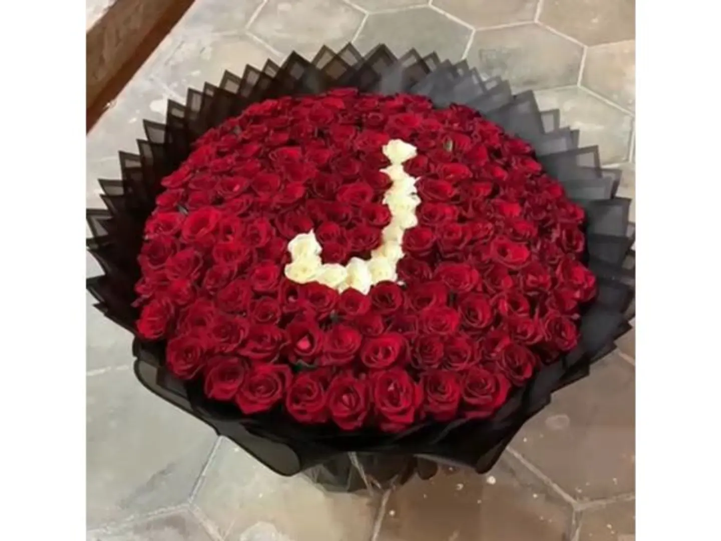A Bouquet Of Red Roses With The Letter