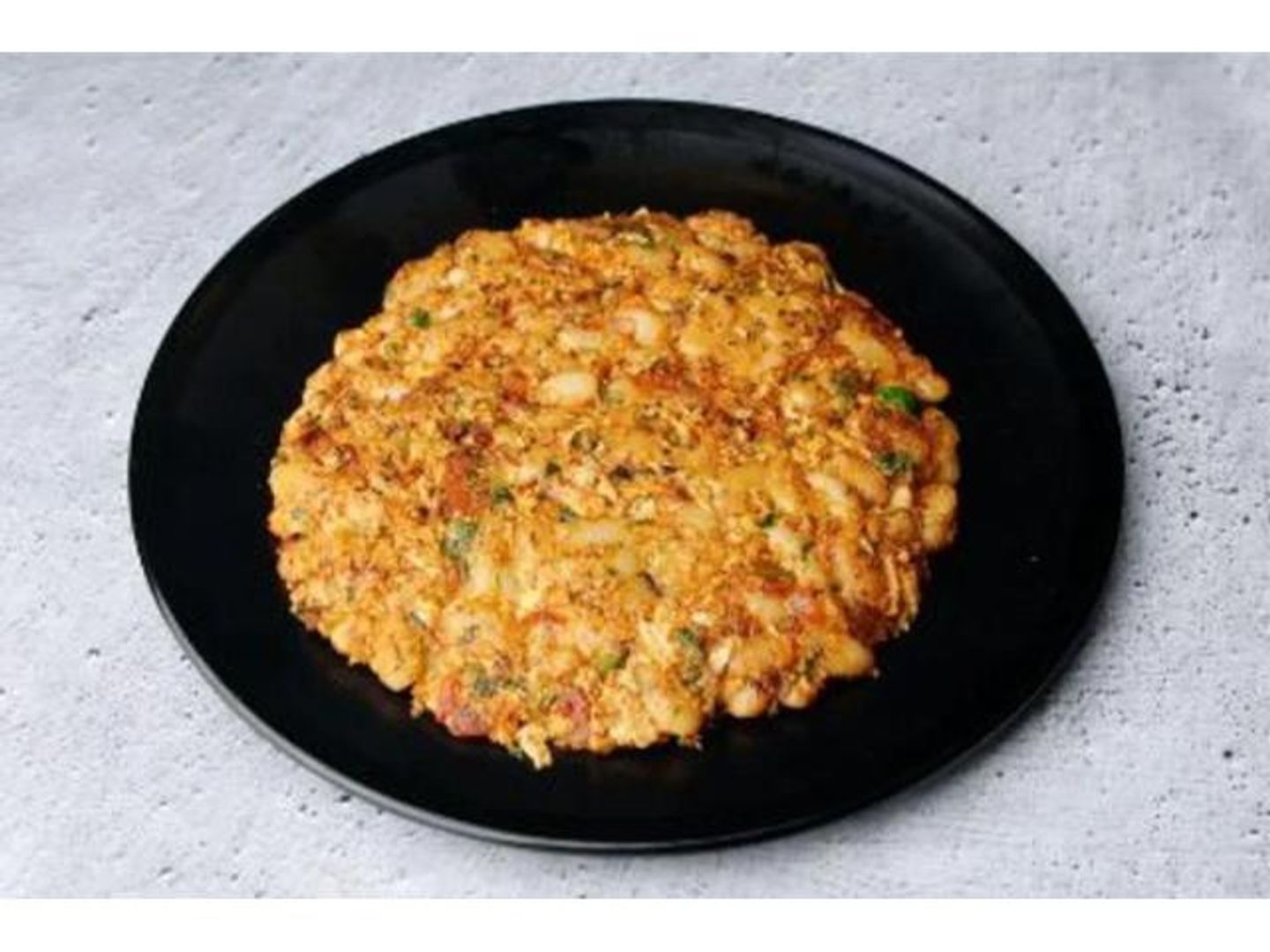 A Plate Of Beans With Eggs