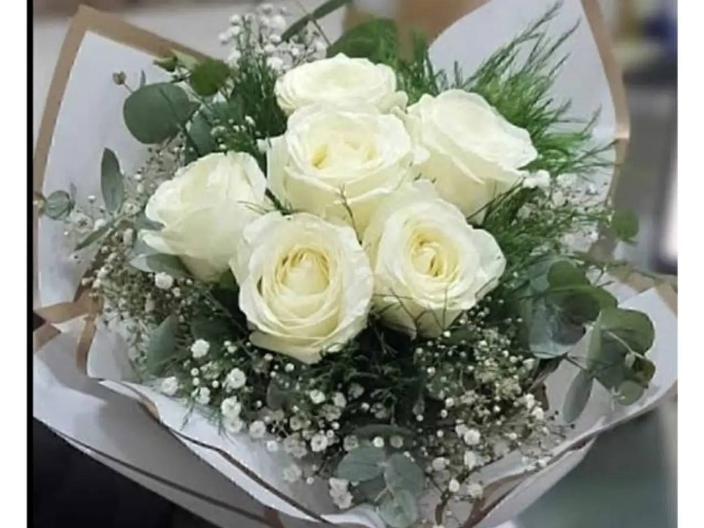 Six White Roses With White Wrapping