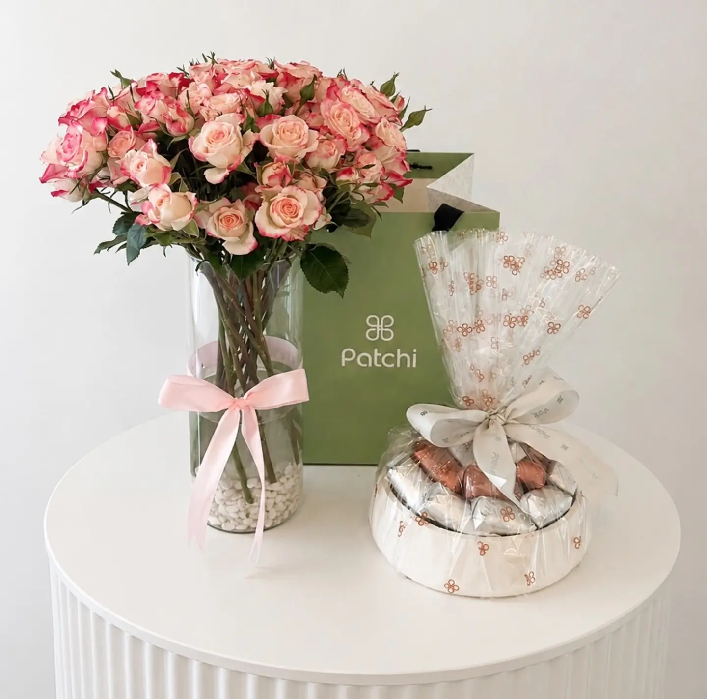 Patchi With A Vase Of Pink Baby Roses