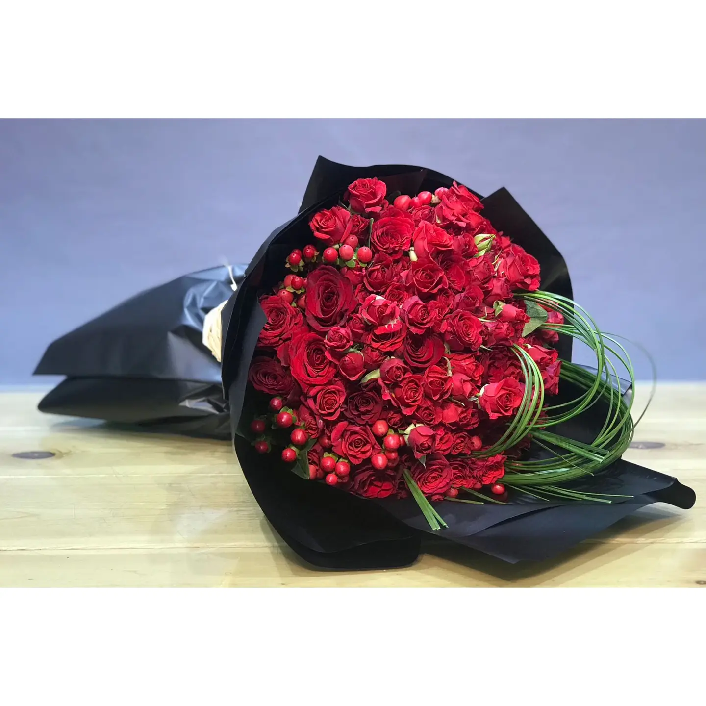 Red Bouquet Of Roses And Steelgrass