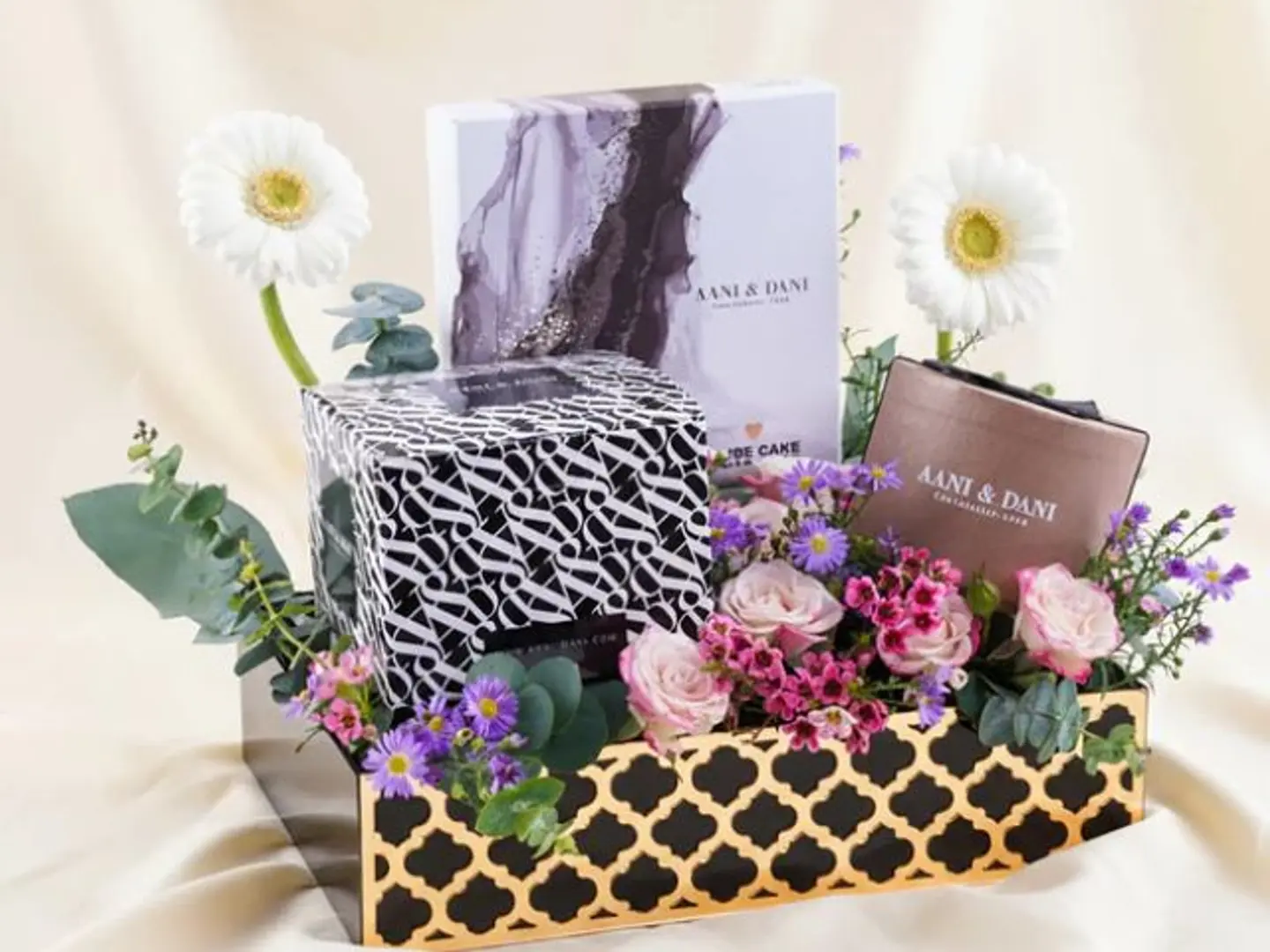 Chocolate Gifts For Annie And Danny, And A Flower Arrangement.