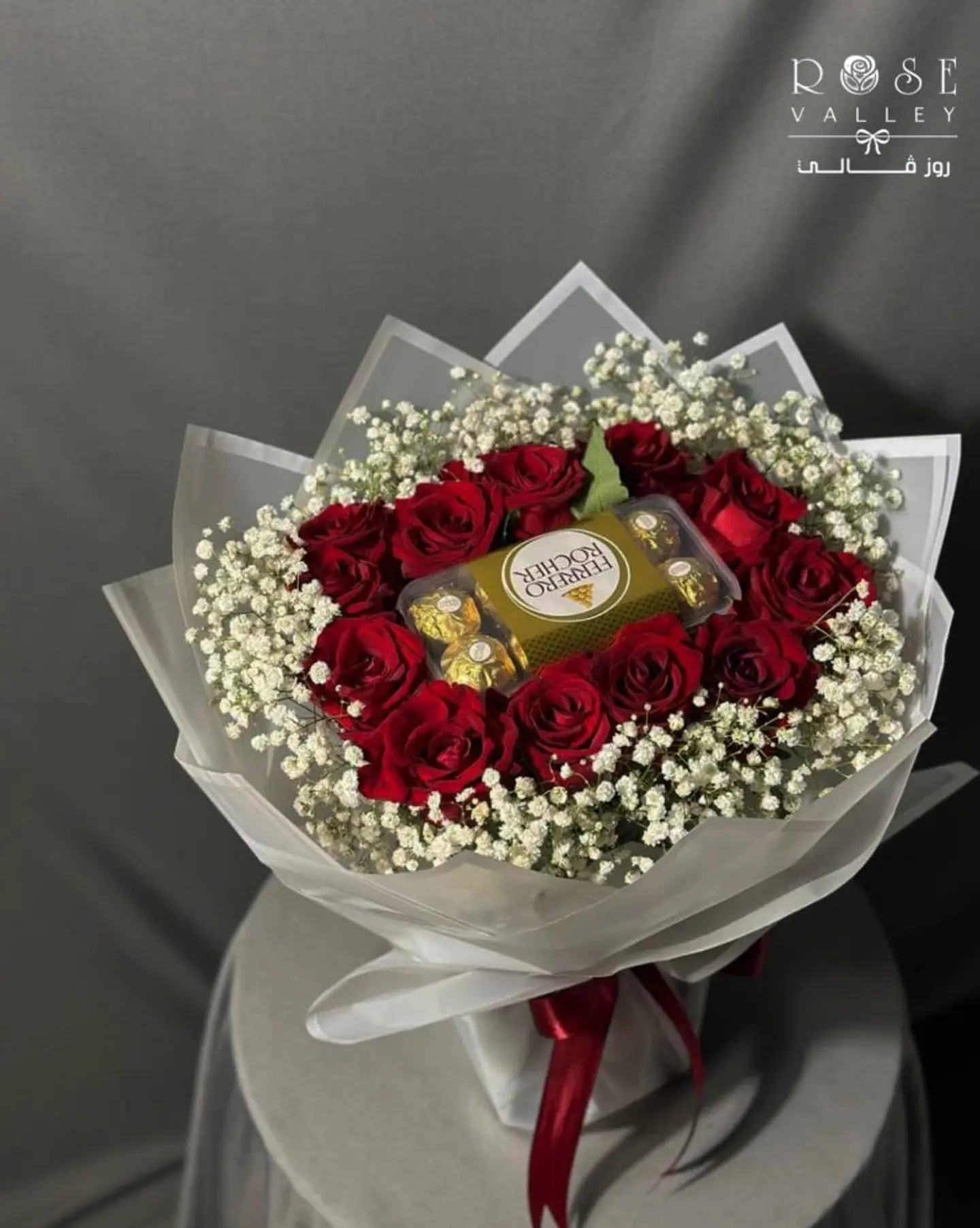 A Bouquet Of Red Roses With A Box Of 16 Ferrochers