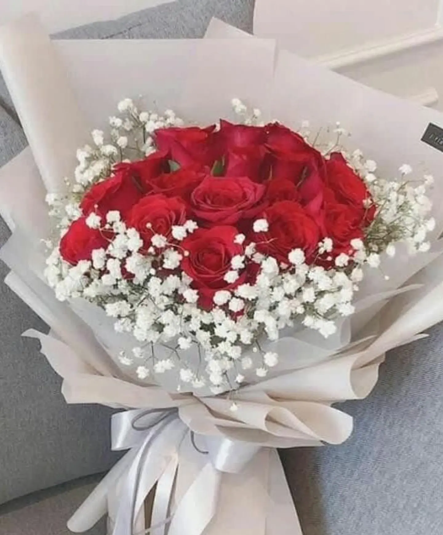 Red Bouquet With Gypsophila And White Wrapping