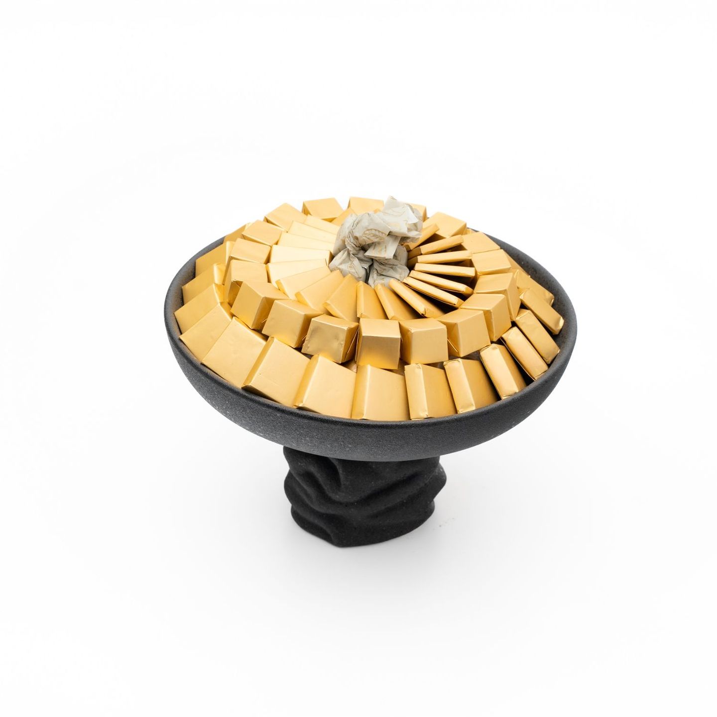 A Small Round Black Chocolate Tray