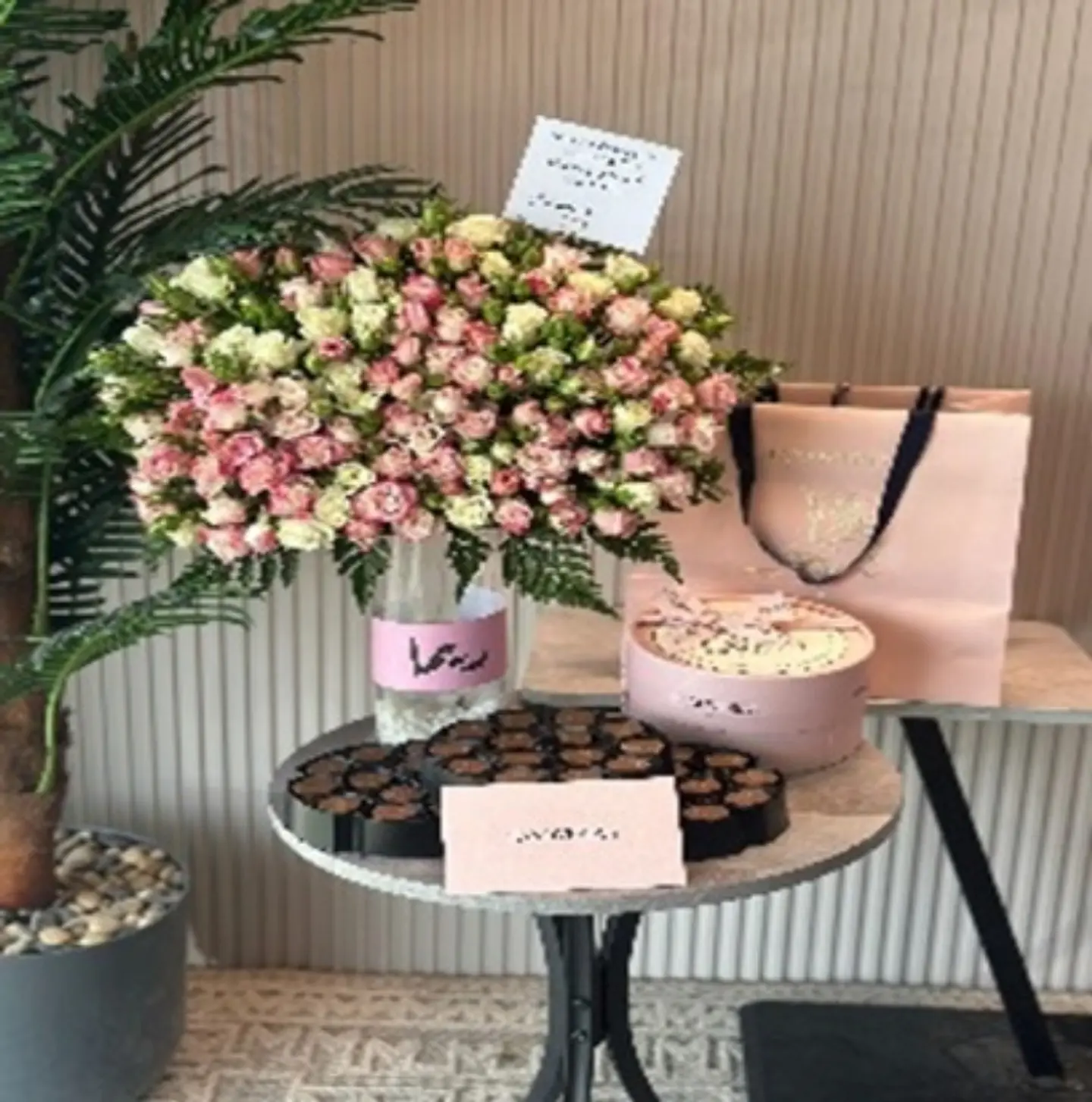 Chocolate And A Vase Of Roses