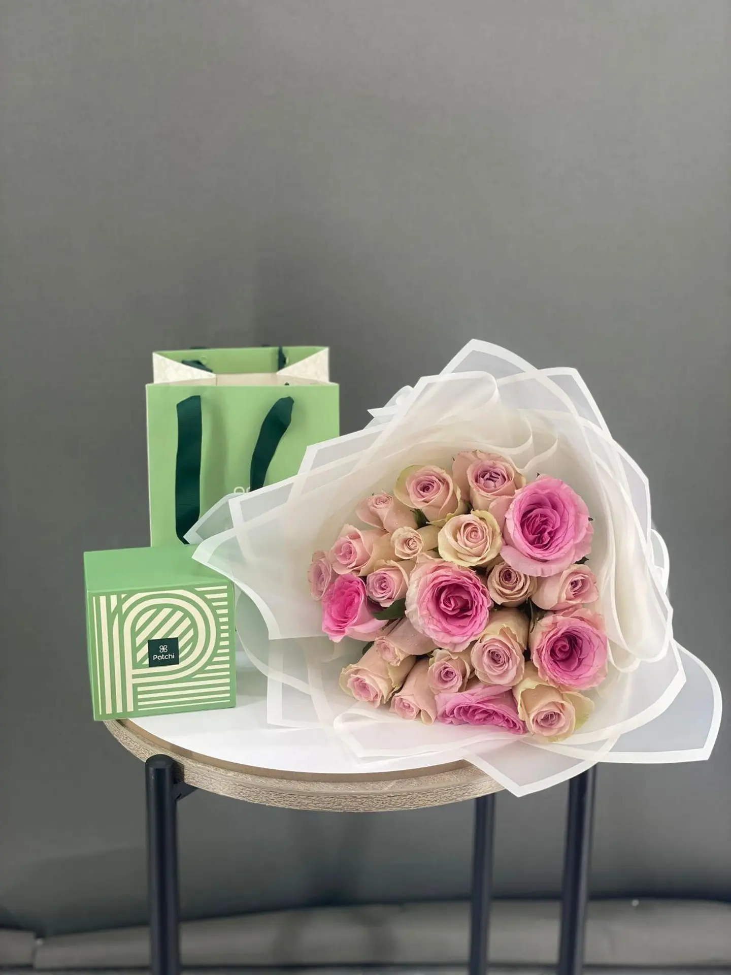 A Bouquet Of Roses With Patchi Chocolates