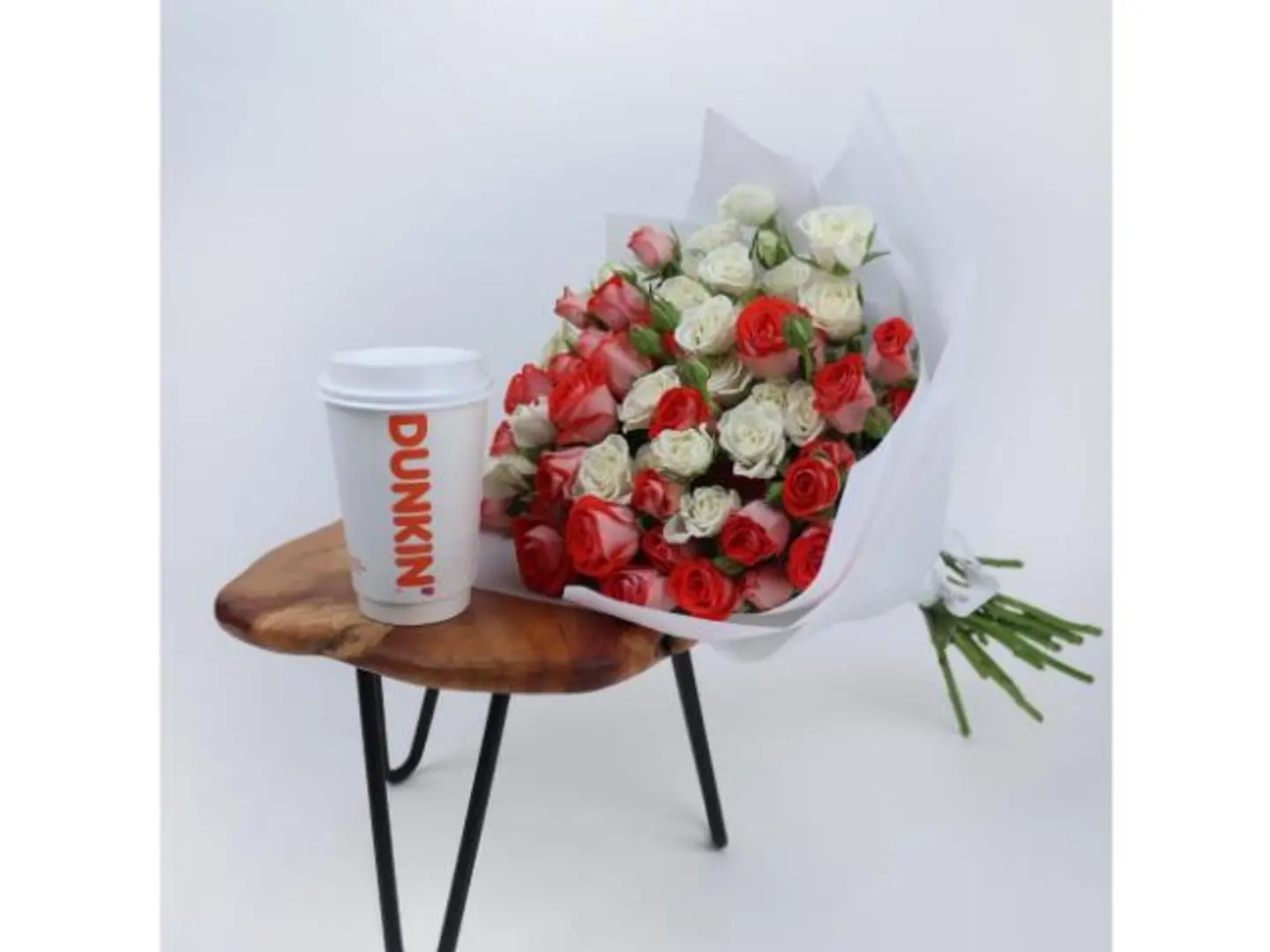 A Bouquet Of Roses With A Cup Of Coffee