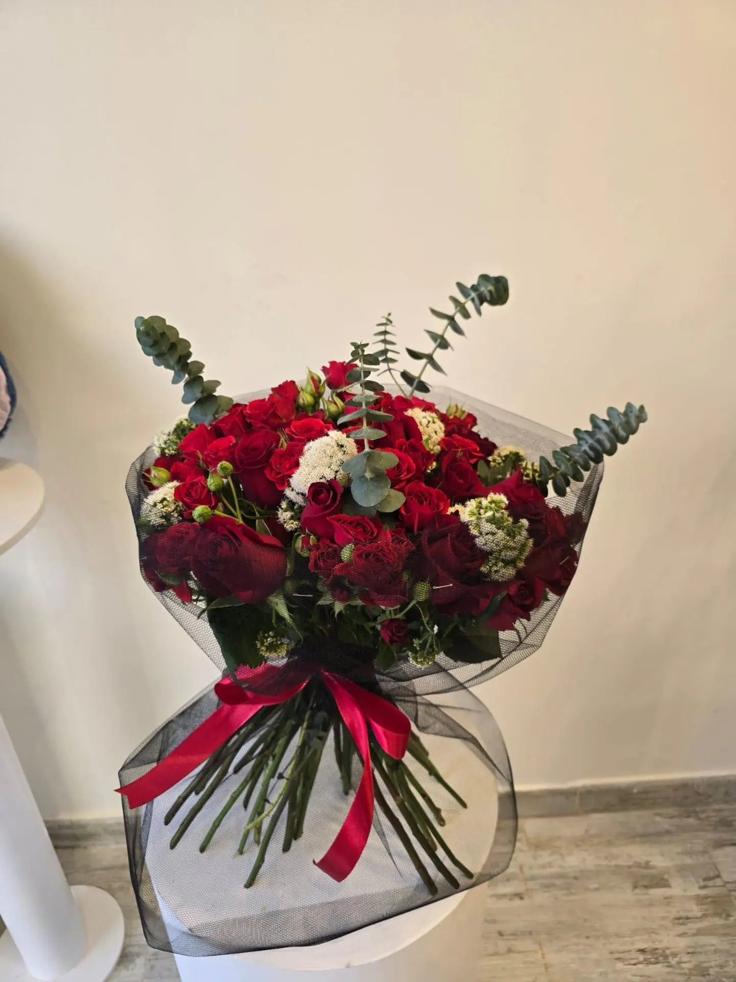 A Red Bouquet With Black Tulle