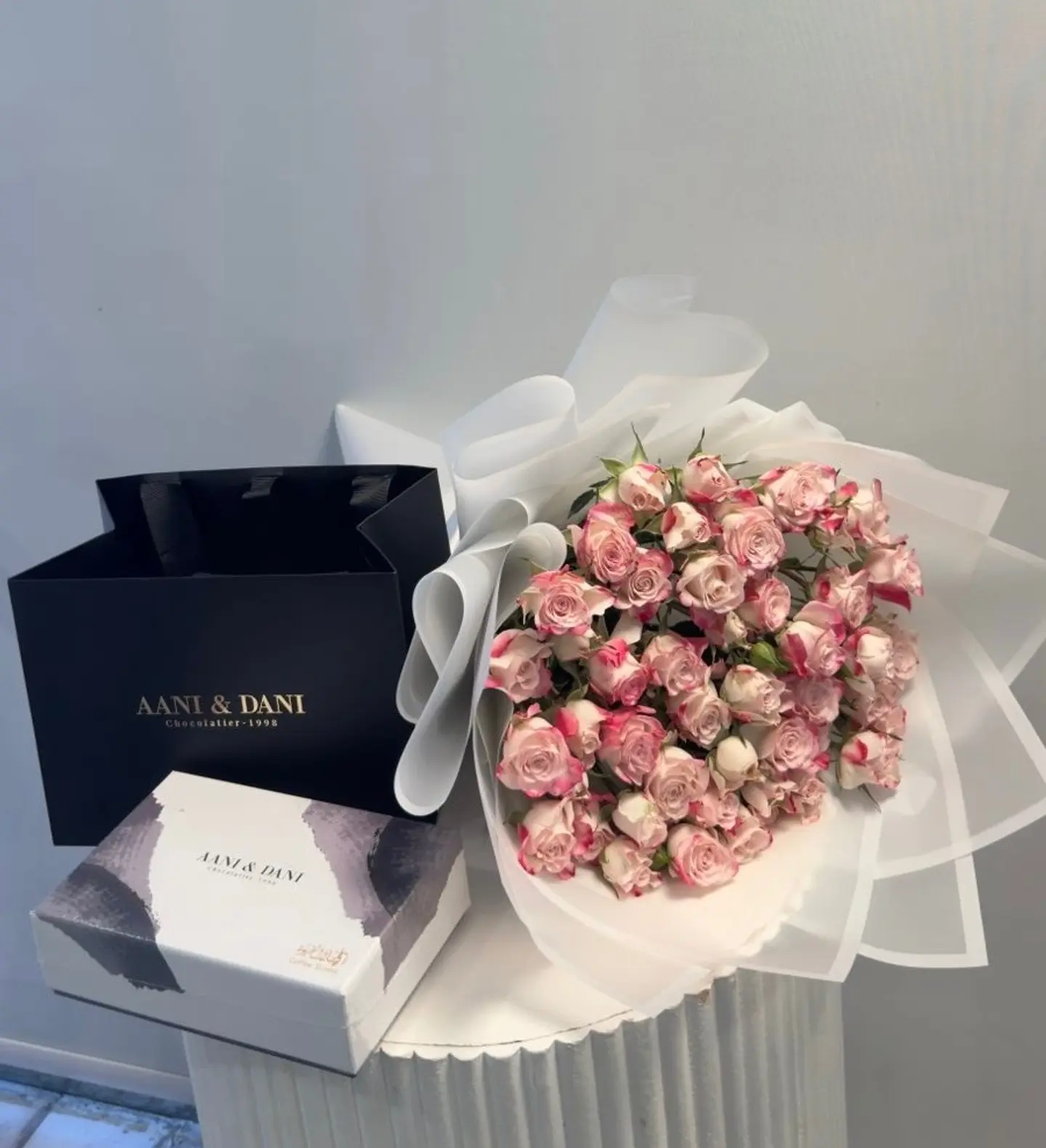 Chocolate For Me And Danny With A Bouquet Of Natural Roses