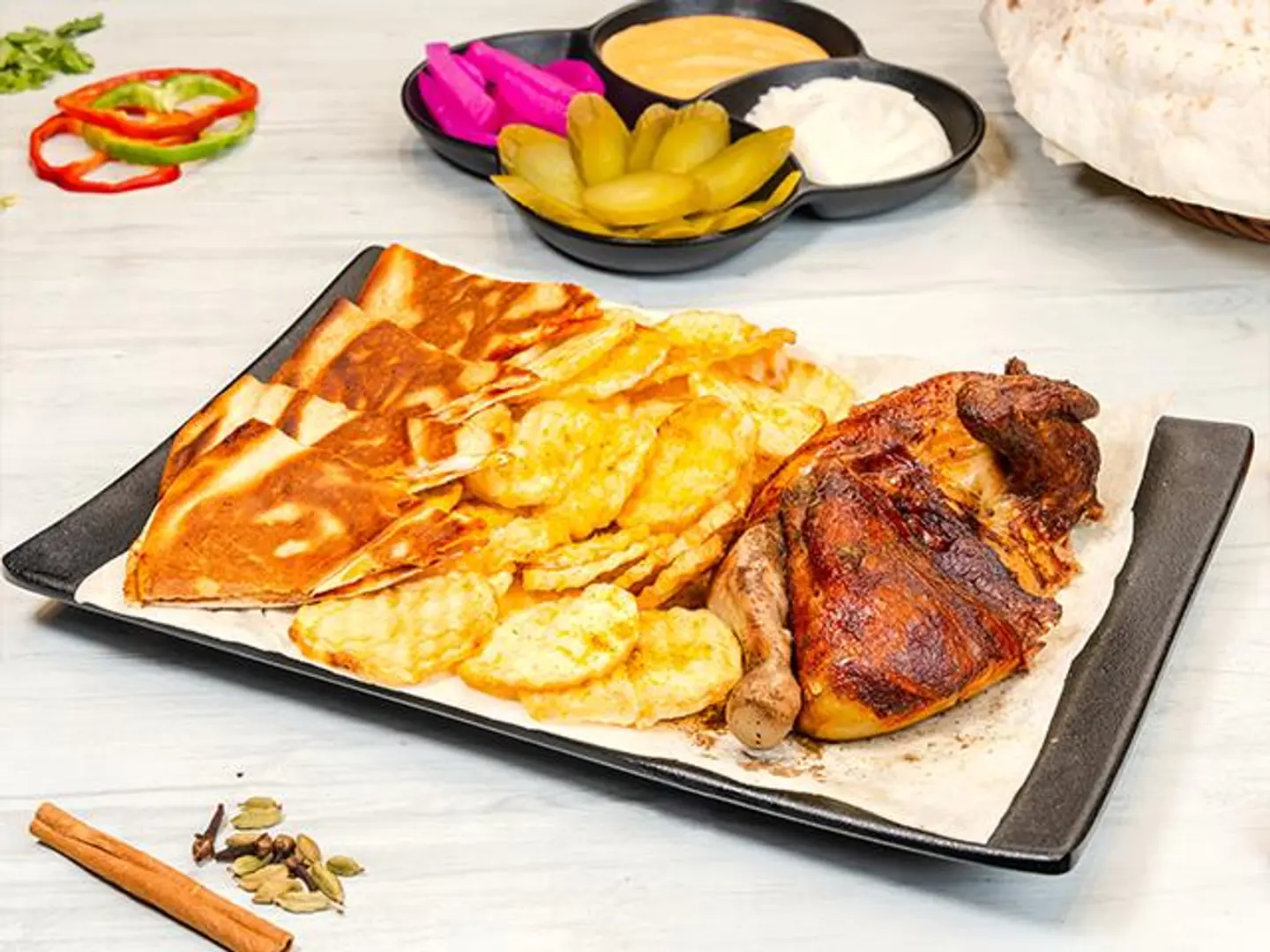 Half A Grilled Chicken With Potatoes
