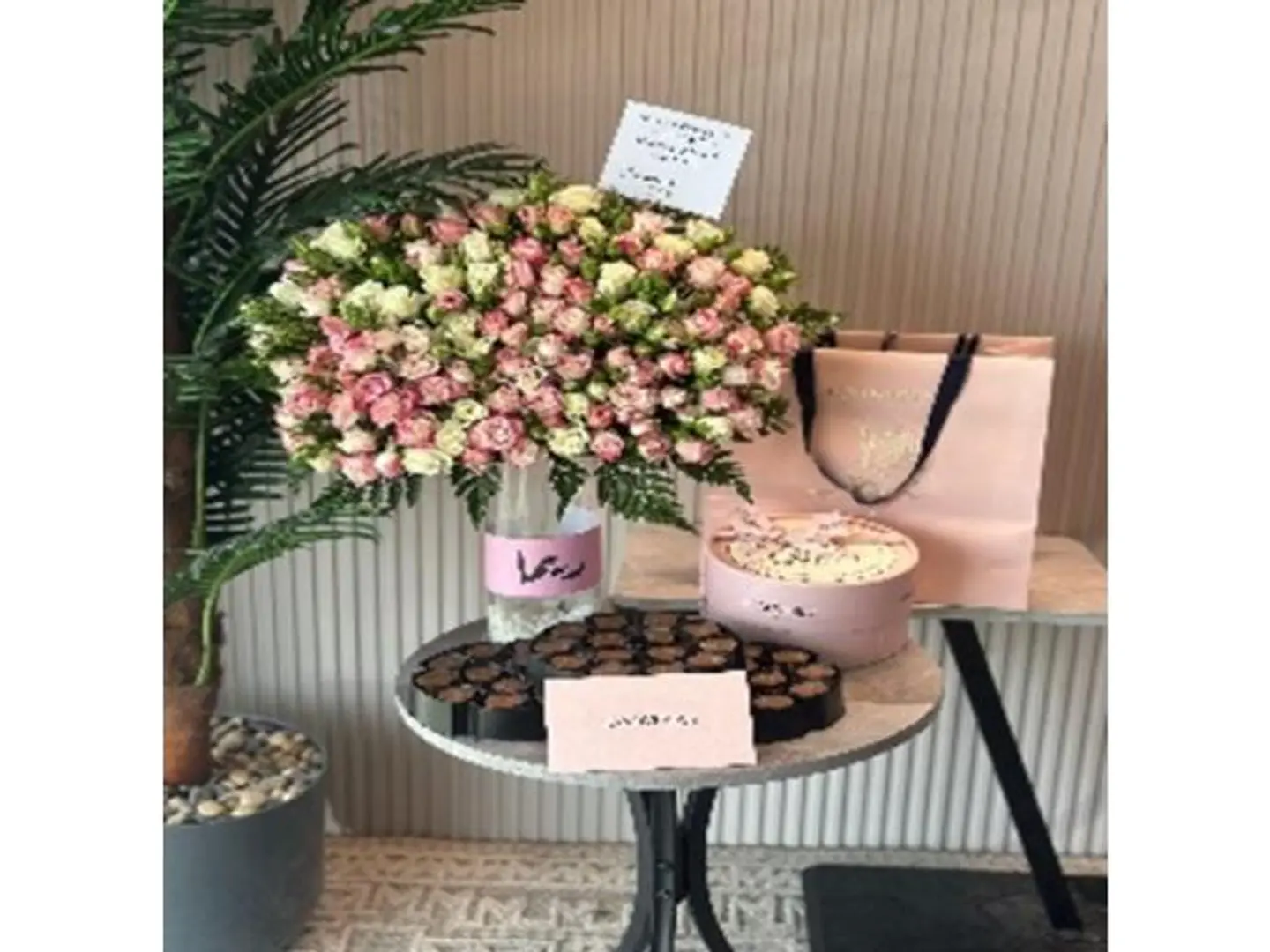 Chocolate And A Vase Of Roses