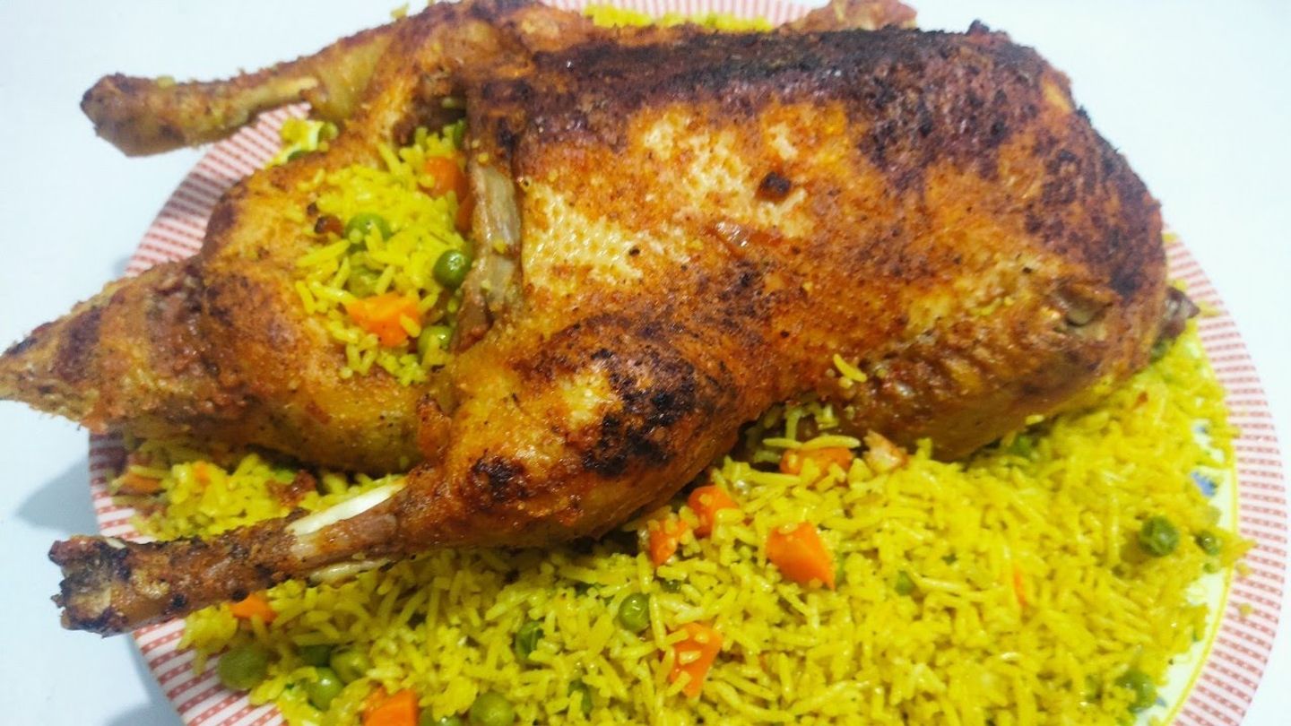 One Piece Of Stuffed Chicken With Rice And Vegetables