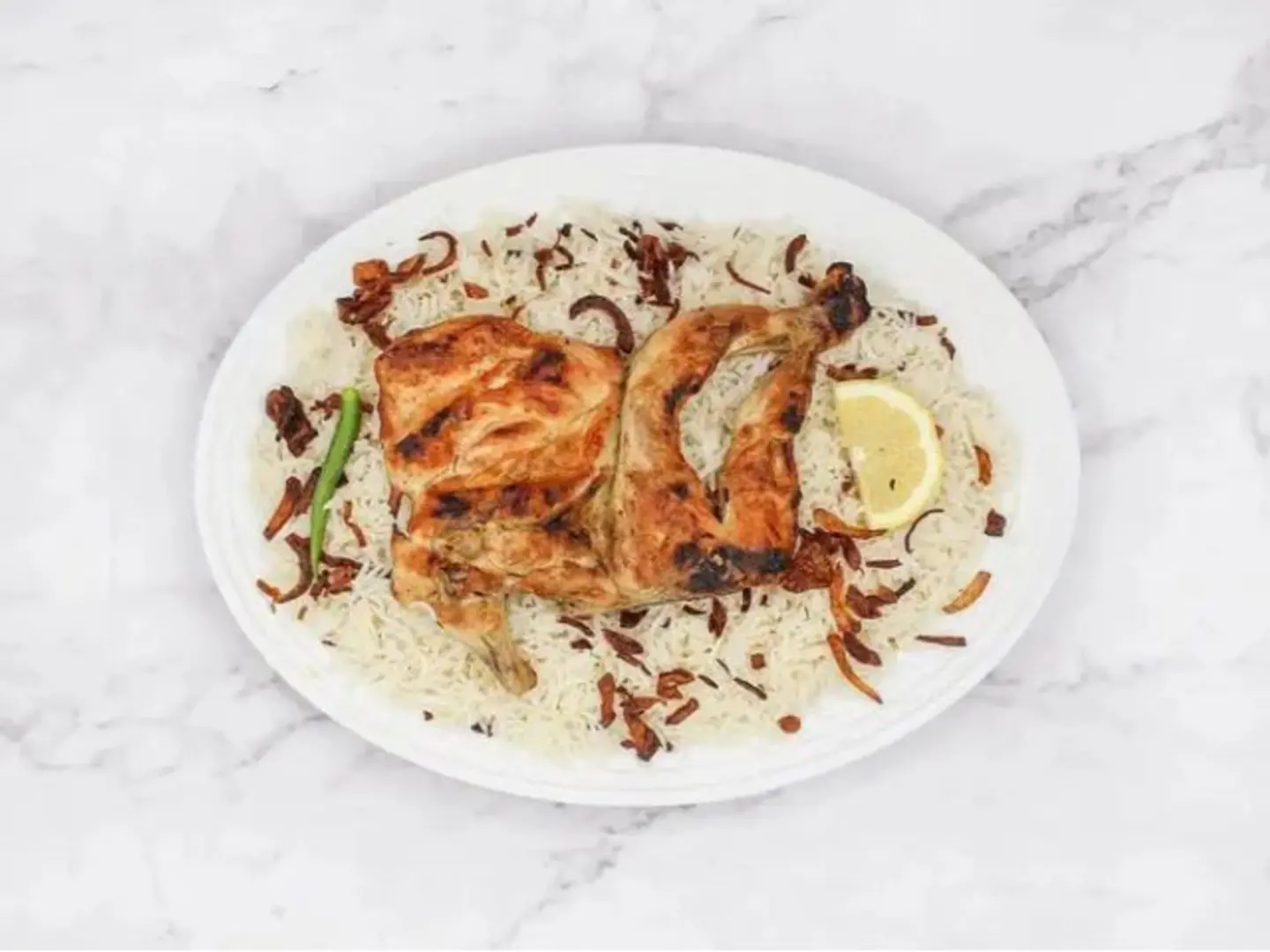 نصف حبة دجاج مظبي أرز شعبي