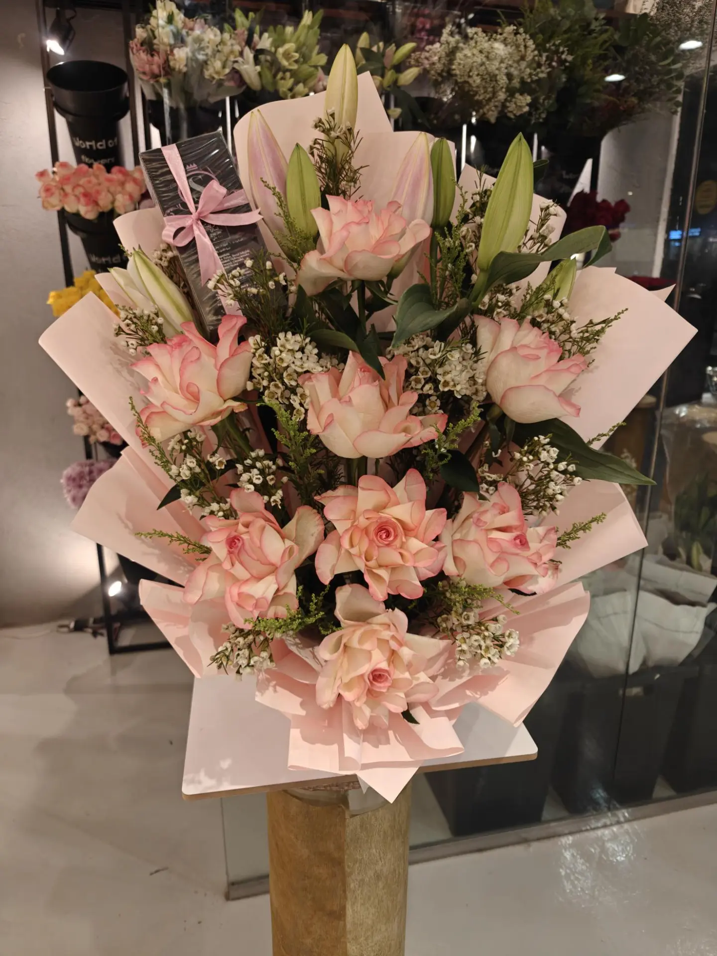 A Bouquet Of Natural Roses With A Women's Perfume