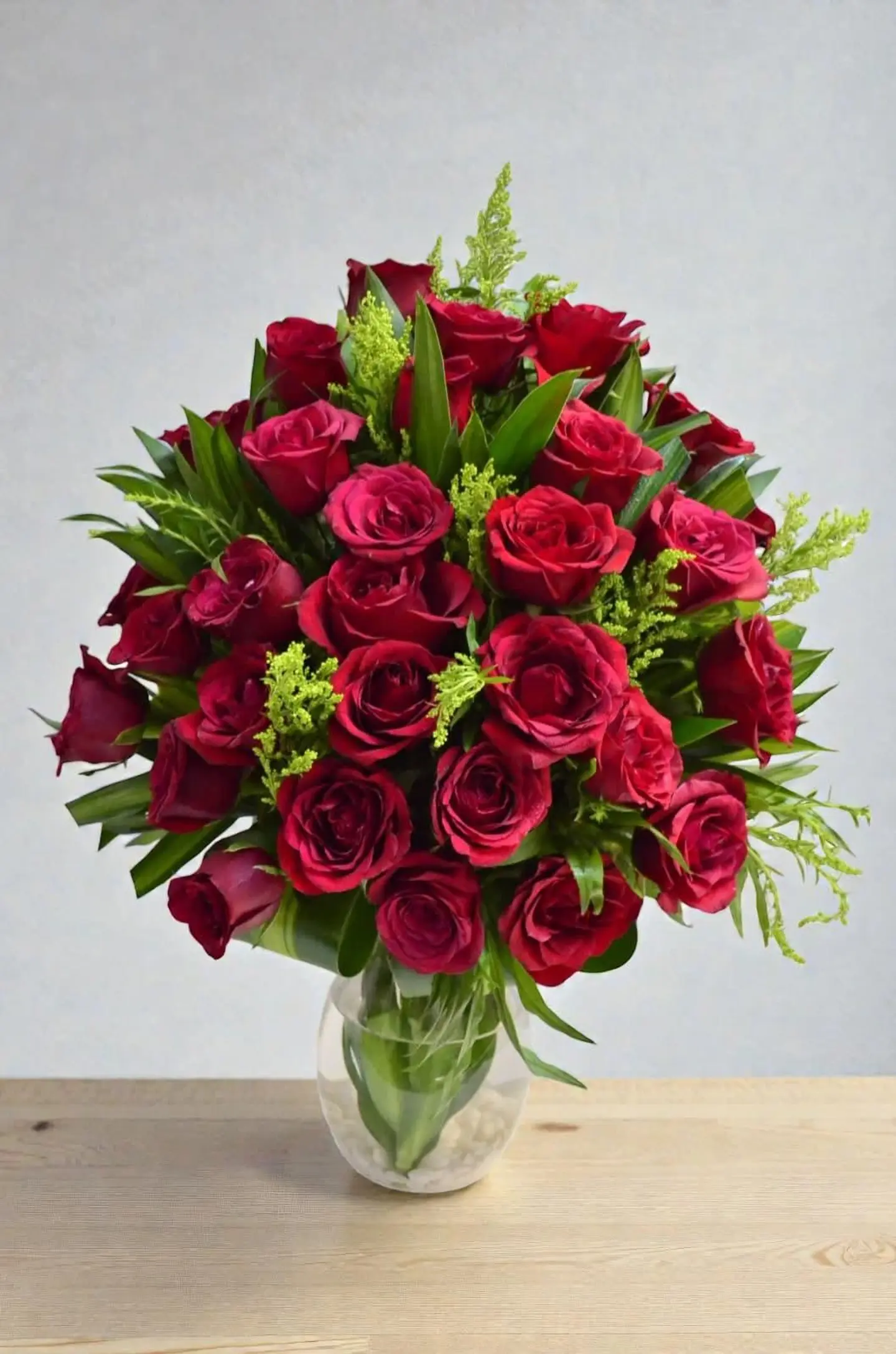 Transparent Vase With Red And Yellow Flowers