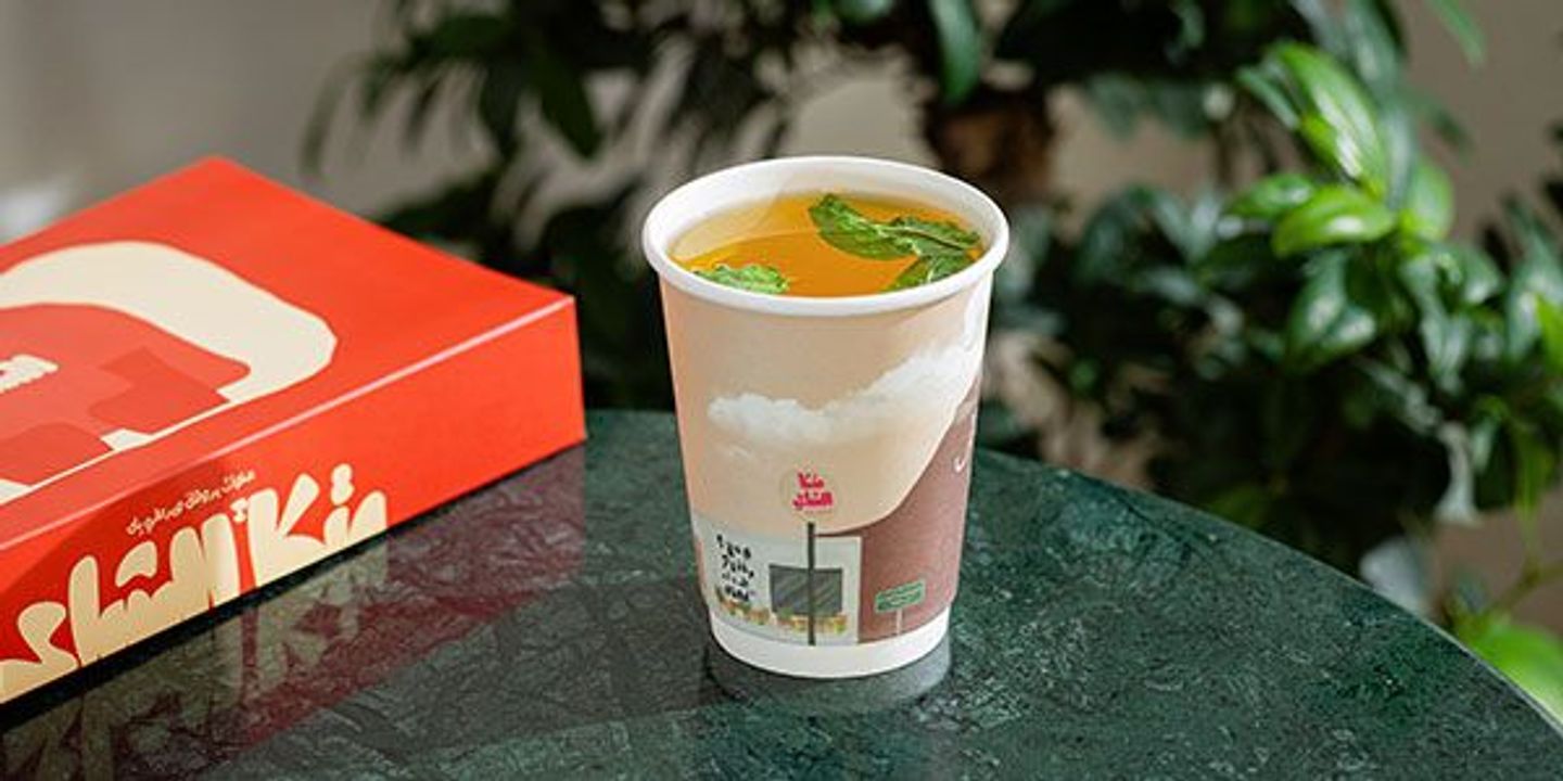 Mint And Saffron. A Large Paper Cup