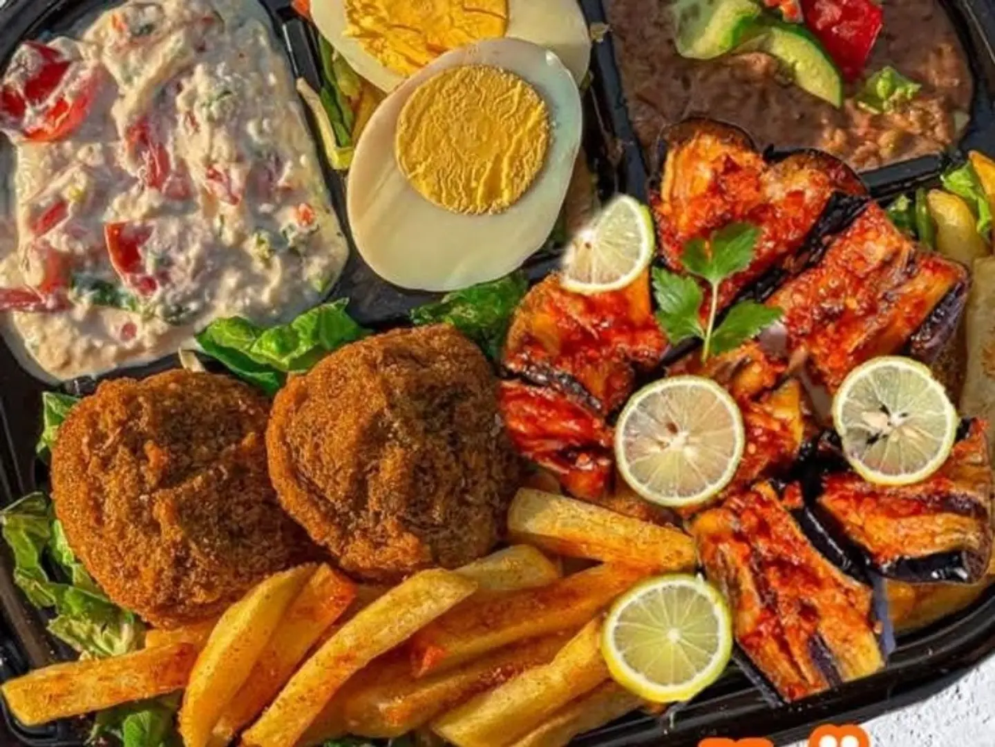 A Small Sized Forming Saucer Of Diverse And Different Varieties Such As Bean, Chickpeas, Spices, Flaflaves, Potatoes, Egg, Muscular, Bread And Pickle