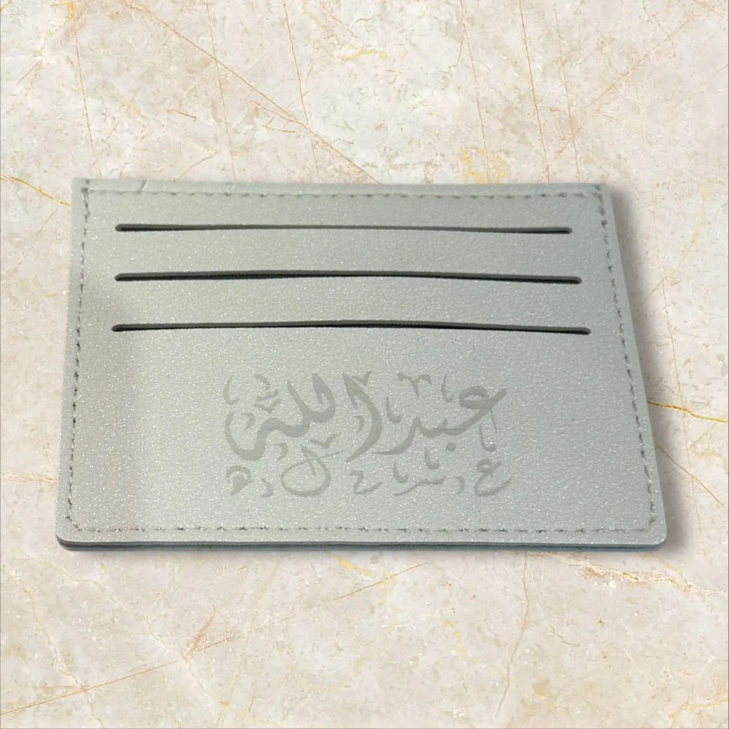 محفظه رصاصي جلد مع نحت الاسم