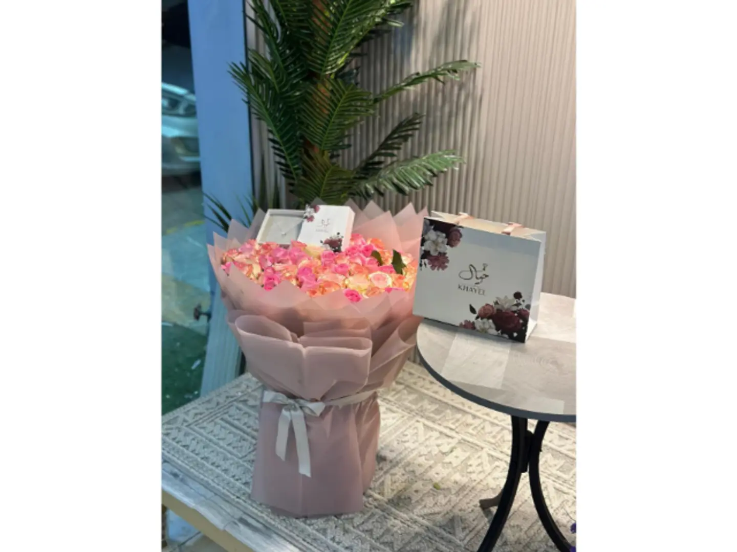 A Bouquet Of Roses With A Necklace From Khayal Bank