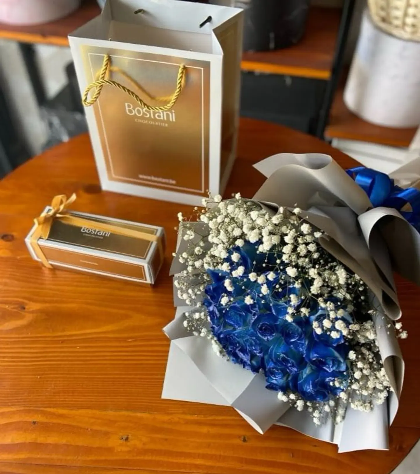 A Bouquet Of Blue Roses With Gardening Sweets