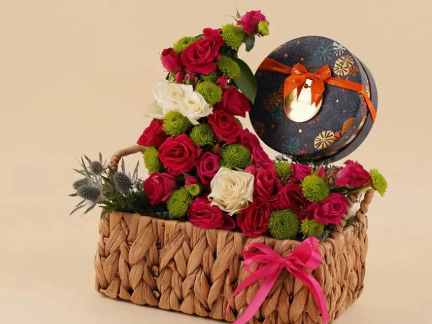 A Basket Of Roses With A Box Of Vinci Chocolates.