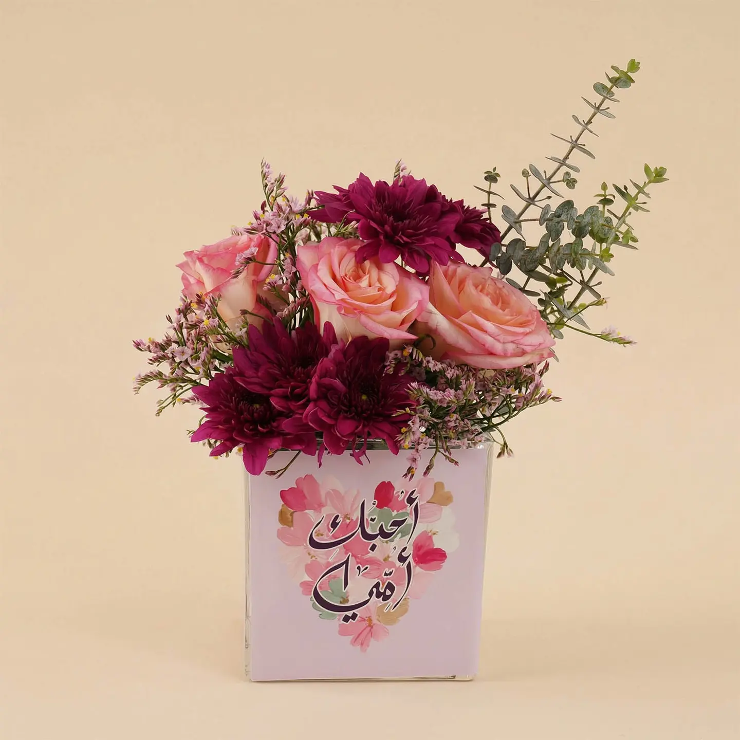 A Vase Of Burgundy Roses And Chrysanthemums As A Gift For Mothers