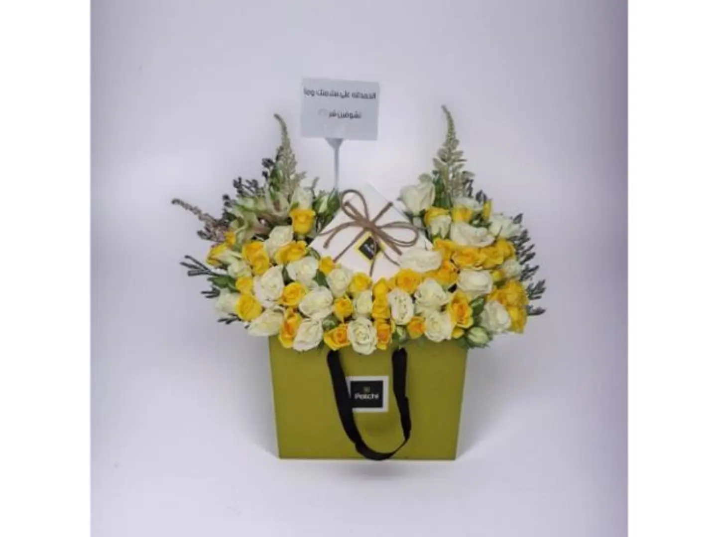 An Elegantly Arranged Bouquet Inside A Patchi Bag