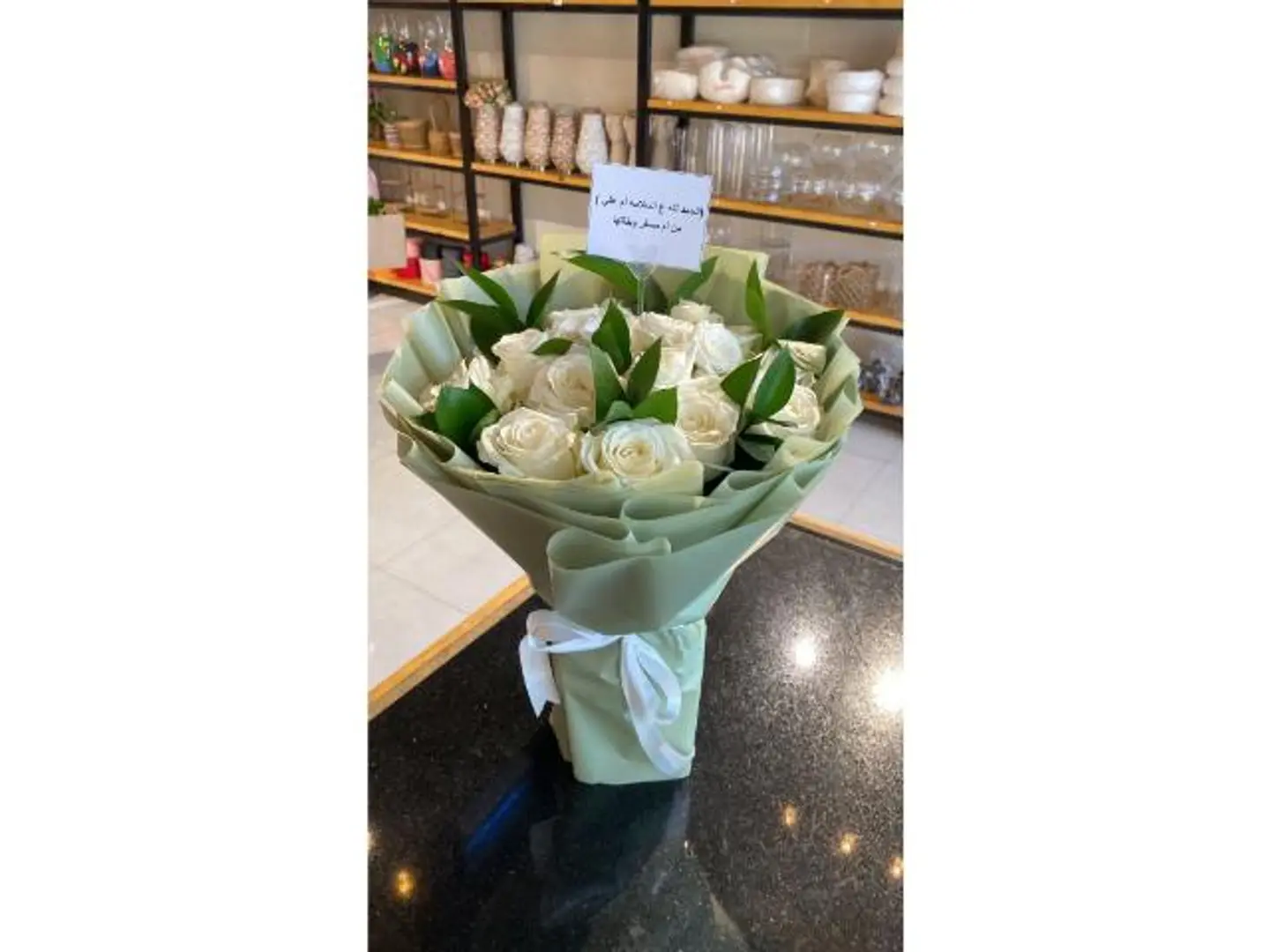 Bouquet With White Roses And Green Wrapping