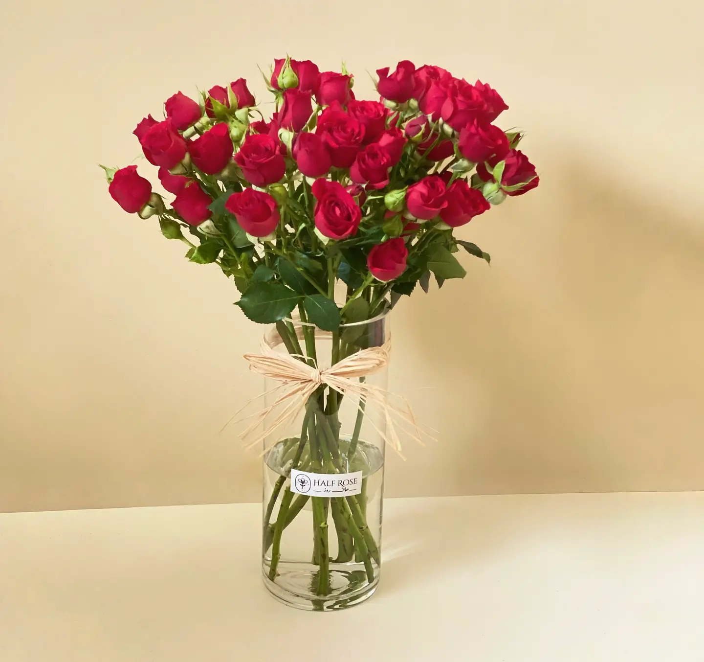 A Vase Of Red Baby Roses