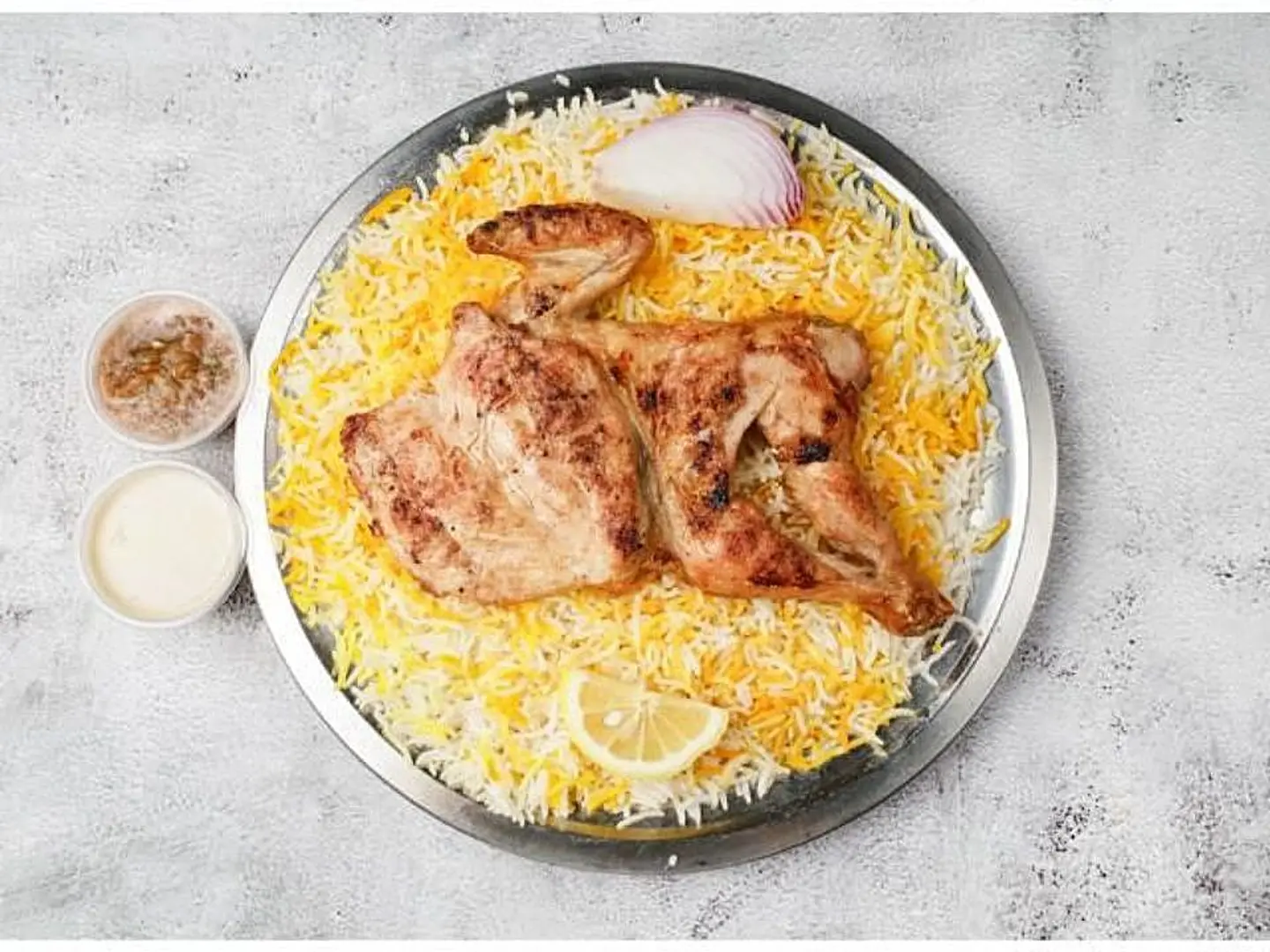 نصف حبة دجاج مظبي مع الرز