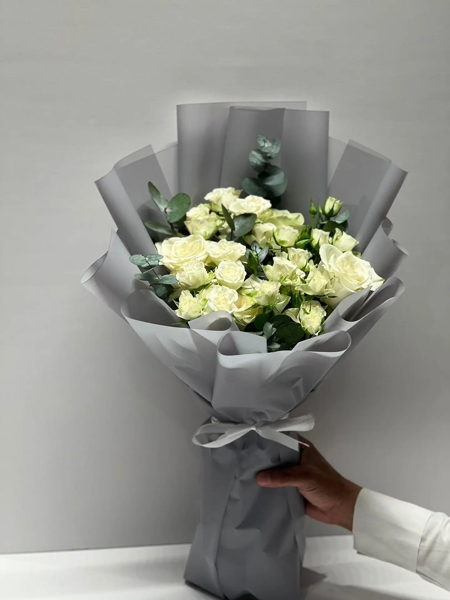 A Bouquet Of Roses And Baby Roses