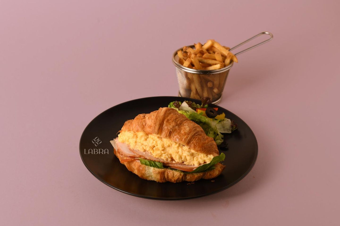 Croissant With Scrambled Eggs And Smoked Turkey Slices