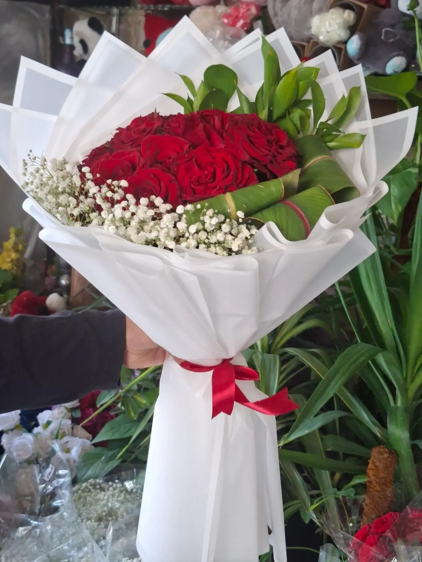 Red Bouquet With Gypsophila And White Wrapping